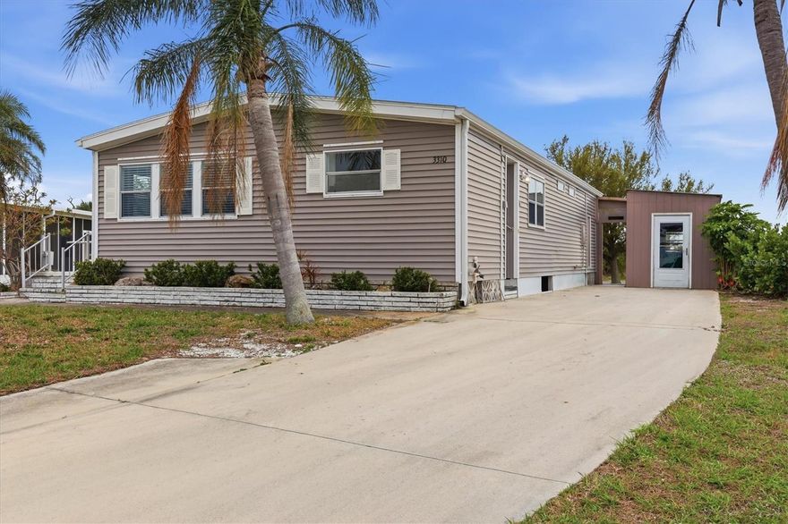 Welcome to this charming double-wide manufactured home located in the desirable Sandalhaven Estates community in beautiful Englewood, Florida. Nestled in a welcoming 55+ deed-restricted neighborhood, this pet-friendly community allows golf carts and offers a relaxed Florida lifestyle with the added benefit that you own the land—no lot fees. Residents enjoy extremely affordable living with annual HOA dues of only $200.
Inside, the home features vinyl flooring throughout, creating a clean and low-maintenance living space. The layout offers comfortable living areas perfect for both relaxing and entertaining. The master suite includes a spacious walk-in closet and sliding doors that open to the rear deck, providing a private spot to enjoy your morning coffee or evening breeze.
Outdoor features add even more convenience and charm. A side patio provides additional space for lounging or grilling, while the utility shed with washer and dryer hookup offers practical storage and laundry options. Hurricane shutters provide added peace of mind during storm season.
Located just minutes from the stunning beaches of Manasota Key and Boca Grande, this home puts you close to some of Southwest Florida’s best coastal living. Enjoy world-class fishing, golf courses, excellent restaurants, and convenient shopping, all within easy reach. Whether you’re looking for a seasonal retreat or a full-time Florida home, this property offers comfort, affordability, and a fantastic location.