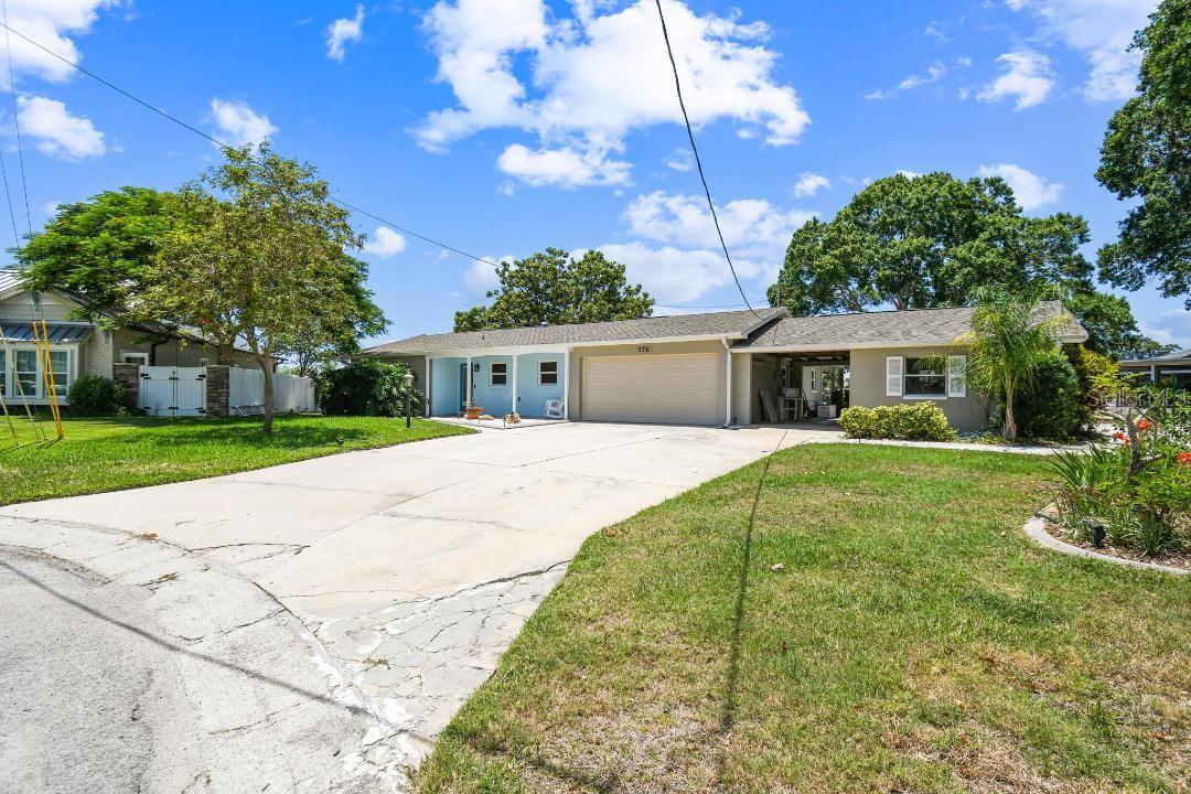 Location, Location, Location! This is your opportunity to customize your dream home in Palm Harbor! This premiere oversized lot on the Westwinds Circle cul de sac in Baywood Village features one and a half parcels with approximately 220 feet of seawall. Enjoy easy deep-water access to the Gulf with no bridges or obstructions....only a 10 min boat ride to the open Gulf waters! The 10,000 lb boat lift is currently working and has recently been refurbished. This waterfront parcel is being sold as-is for the land value but has potential to be renovated under the FEMA 50% rule as a single-story home. Please Note: Hurricane Helene was the first time since this home was built in 1963 that the home has had flood damage. In the family friendly, boat loving community of Baywood Village, you are also only minutes from the Pinellas Trail, Fred Howard Park Beach, Sunset Beach, Honeymoon Island, and Innisbrook Golf Resort as well as right in the middle between both downtown areas of Tarpon Springs & Palm Harbor....so don't miss out on viewing this property if you're ready to start living the Salt Life...Bring your Vision & Offer!