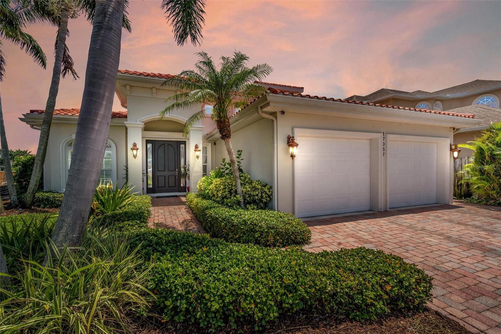 Welcome to your waterfront oasis! This immaculate home is the epitome of casual elegance. With its continuously updated features and stunning waterfront location, this property is a true gem.
As you step inside, you'll be greeted by the spacious living area adorned with 10-foot ceilings and crown molding, creating an atmosphere of grandeur. The impact-rated windows and doors allow natural light to fill the space while providing peace of mind and energy efficiency. The gas fireplace adds warmth and ambiance to the indoor environment.
The master suite, conveniently located on the ground floor, offers a tranquil retreat with a large ensuite bath. Pamper yourself in the master bath featuring a Pearl jetted tub, capable of holding 150 gallons of soothing water.
This home is designed for entertainment and relaxation. Step outside to discover a heated saltwater pool, perfect for year-round enjoyment. Unwind in the outdoor shower or indulge in the luxury of the infrared sauna. A covered lanai provides refuge from the sun, or you may choose to soak up the sun on the pavered patio area. There is access from the outside to a half-bath for convenience when enjoying the pool or outdoor activities. There is an additional half-bath downstairs to assure convenience and comfort for your guests.
For the avid boater, this property is a dream come true. With its own dock and a 13,000 lb boat lift, you'll have easy access to the wide canal, offering mesmerizing Intracoastal Waterway views. Cruise to the Gulf of Mexico with ease and explore the warm Gulf waters.
Inside, the custom kitchen is a chef's delight, boasting solid wood cabinets, granite countertops, and top-of-the-line appliances. A gas cooktop is a rare find and perfect for the home chef. There’s an informal dining space just off the kitchen allowing casual meals with views of the pool and waterway. The formal dining room is a showstopper with a 16-foot coffered ceiling and indirect lighting, creating an intimate and luxurious dining experience. Also, on the ground level you will find a great place to work in the formal office, with custom shelving and hardwood floors. The office could be used as a 4th bedroom if needed as it has a large closet.
Upstairs you will find a serene retreat with two bedrooms, a full bath, a sitting area and balcony.
Situated on a dead-end street with underground utilities, this waterfront neighborhood offers a peaceful and serene environment. The newer seawall ensures the integrity of the property, while the short distance to the beach provides endless opportunities for leisurely strolls along the shoreline.
In summary, this waterfront home is a rare find, combining luxurious amenities with a breathtaking location. From the heated saltwater pool and dock to the master suite on the ground floor and the gas appliances in the custom kitchen, every aspect of this property exudes elegance and functionality. Don't miss the opportunity to own this slice of paradise – it's truly a beach paradise!