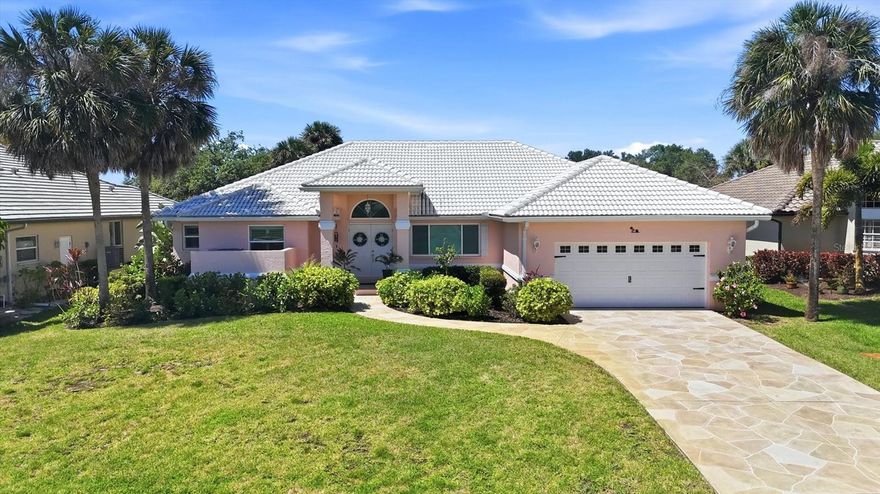 Experience the ultimate waterfront lifestyle in paradise with this beautifully updated, coastal-inspired home perfectly positioned along the scenic Amberjack Waterway. Offering shallow boating access to Coral Creek, Lemon Bay, and the Gulf of Mexico, this property is ideal for those who love to kayak, paddleboard, or cruise the backwaters right from their own backyard. With highly sought-after southwest rear exposure, you’ll enjoy stunning sunsets over the water, all from your oversized lot featuring a spacious backyard and a private 5’ x 20’ dock.  Designed for relaxed coastal living, the home showcases a light, airy interior with a serene beachy vibe and numerous high-quality updates throughout. The fully renovated kitchen (2026) is a standout, featuring Arctic White European frameless soft-close cabinetry, GE stainless steel appliances, quartz countertops, and a 4” x 12” Italian glass decorative backsplash, all perfectly positioned to overlook the pool and canal from the bright eat-in dining area. A stylish shiplap accent wall adds warmth and character, while new luxury vinyl plank flooring flows through the main living areas and primary suite. Plantation shutters, updated closet interior doors, modern fixtures, and ceiling fans complete the polished, move-in-ready feel.  Peace of mind comes with a long list of major improvements, including impact-resistant windows and doors, a tile roof (2018), water heater (2022), A/C system (2023), impact-rated garage door (2023) & new soffits around entire home (2023), and freshly painted exterior (2024). Step outside to your private tropical retreat, where the pool area invites you to relax and unwind, enhanced by a new aluminum pool fence (2023), spa pump (2024), and pool pump (2025)—perfect for effortless outdoor enjoyment year-round.  The spacious primary suite serves as a tranquil escape, featuring crown molding, plantation shutters, LVP flooring, a large walk-in closet, and peaceful views of the pool and waterway. All guest bedrooms are generously sized and include walk-in closets, offering comfort and privacy for family and visitors alike.  Additional features include a decorative surfaced concrete driveway, an oversized two-car garage with a freshly painted floor, well-fed irrigation, and a preventative termite protection plan. Located just minutes from pristine Gulf beaches, golf courses, restaurants, and shopping, this exceptional waterfront home delivers the perfect combination of luxury, convenience, and laid-back Florida living—your own piece of paradise awaits.
