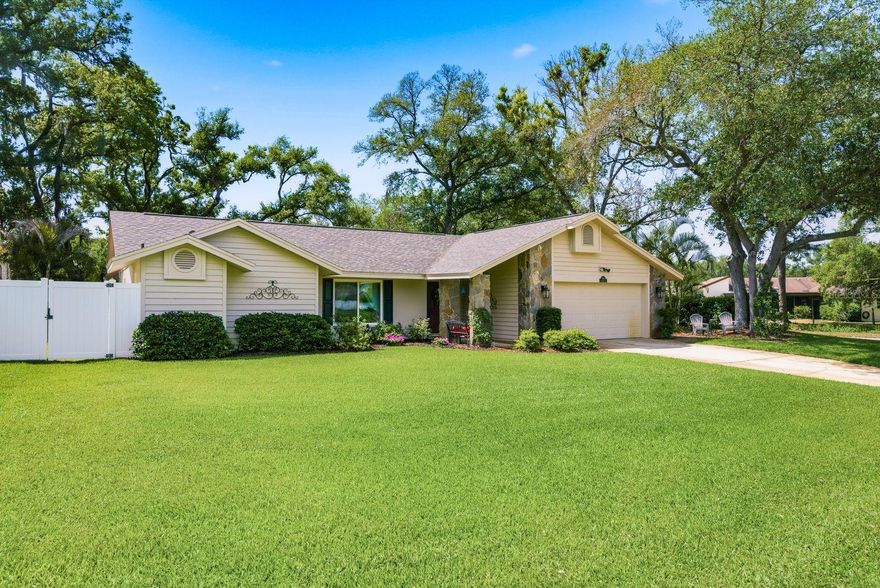 Welcome to your dream home nestled in the heart of sought-after Safety Harbor, where charm meets modern luxury on a premium corner lot spanning an impressive .42 acres. This beautifully updated four-bedroom, three-bathroom residence offers 2,412 square feet of thoughtfully designed living space that seamlessly blends comfort with style.

Step inside to discover an attractive split floor plan featuring a formal living room and dining room adorned with engineered hardwood floors. The large family room boasts a wood-burning fireplace, perfect for cozy evenings, while the same gorgeous hardwood flooring flows throughout. The stunning updated kitchen is truly the heart of this home, showcasing shaker white cabinetry, granite countertops, upgraded appliances, a large breakfast bar, and a spacious pantry complete with wood shelves and lighting.

The generous primary bedroom offers double walk-in closets with custom organizers and elegant porcelain plank tile flooring. The private ensuite bathroom has been beautifully renovated with new cabinetry, granite counters, and a frameless glass shower featuring double shower heads. The additional bedrooms are equally impressive, with spacious layouts and porcelain plank tile flooring. Both additional bathrooms have been tastefully updated with granite counters, custom mirrors, and modern fixtures. Even the laundry room received the royal treatment with new cabinets, granite counters, and a stainless steel sink.

Now, let's talk about that backyard — because it truly steals the show. The resort-style pool area features a resurfaced pool and spa, elegant travertine decking, a new lanai pool enclosure, and completely new pool equipment including a heat pump, saltwater chlorinator, and variable speed pump. All of this overlooks an oversized backyard that practically begs for weekend gatherings.

The updates don't stop there. A new roof installed in late 2023, hurricane-impact windows and sliding glass doors, fresh exterior paint, a new electrical panel, vinyl fencing, and a deep well irrigation system with seven automatic zones ensure this home is as practical as it is beautiful.

Located in Safety Harbor's charming neighborhood, you'll enjoy easy access to the quaint downtown area brimming with restaurants, shops, and local attractions that make this community truly special.

Homes like this rarely come along — schedule your private showing today before this gem finds its forever family!