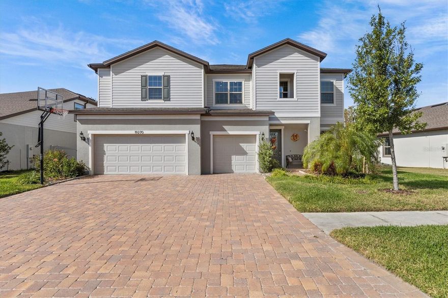 Welcome to your dream home in K-Bar Ranch of New Tampa! Built in 2020 by Pulte Homes, this one of a kind Casabella floor plan offers 6 beds, 4.5 baths, and a 3-car garage, all thoughtfully designed for modern living at over 5300sqft. This home is sure to wow with all of its added features! As you enter the foyer you’ll be greeted with ceilings at 10ft on the main floor and 9ft on the second, a flex room, powder room, and formal dining space. The luxury vinyl plank floors throughout the main floor create a cohesive and stylish look. The gourmet kitchen features quartz countertops, stainless steel appliances, spacious island seating, a cafe eating space, and the walk in pantry of your dreams! The electric fireplace really ties the living space together and can warm the room during the short Florida winters. Just outside your sliding glass doors is your brand new fully enclosed lanai, heated salt water pool and spa, and full outdoor kitchen overlooking conservation views for added privacy. A special highlight of this floor plan is the massive primary bedroom on the ground floor that features an en-suite bathroom with a walk-in shower, claw-foot tub, walk-in closet with built-ins and glass sliders that open to breathtaking views of the pool. Notice the NEW luxury vinyl plank floors and NEW stair lighting as you ascend to the second floor. The space opens up to a large loft, 5 additional bedrooms, 3 bathrooms, laundry room with utility sink, and an added Movie room! No wasted space in this home as you’ll notice the large bedrooms, walk in closets and additional hallway storage closets. The movie room is yours, featuring wood paneled walls, 5 reclining seats, and all media equipment! You’ll never have to leave! But if you must, you can grab your things from the mudroom and exit through the 3 car garage oversized garage. With epoxy flooring and additional space for storage or a golf cart. A step above the rest, this home is ready with features you won’t get from anything else on the market. Additional updates include paid off Tesla solar panels with power wall, water softener, water filtration system, in-wall pest control system and premium finishes throughout. Keep in mind that this impeccable home sustained zero damage from this hurricane season, and the power wall can power the entire home during power outages! This home combines luxury and practicality, making it the perfect place to create lasting memories. Schedule your showing today and experience the perfect blend of style, comfort, and nature! *** Buyer may be eligible for lender concession when working with preferred lender - inquire for details.** Located close to Top rated schools, Shopping centers, Wire Grass Mall, Tampa Premium Outlets, USF, Moffit Hospital, Restaurants, gym, I-75, I-275 & Much more. This neighborhood features a private community swimming pool, playground, tennis courts marked for pickleball, and walking trails. Don't miss your opportunity to buy this beautiful move-in-ready house.