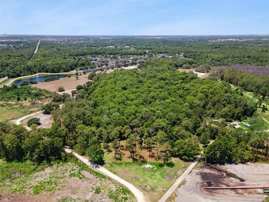 This 4.53-acre parcel in Davenport offers the ideal setting for your next development opportunity! With mostly high-and-dry land and a highly desirable location backing up to an established neighborhood, this property is perfectly positioned for residential expansion or future investment in a rapidly growing corridor. And if purchased along with the lot next to it (G5112274), you would have 30 acres available for your project! The property’s layout and accessibility make it an excellent canvas for a thoughtfully planned project, offering both privacy and convenience while benefiting from surrounding residential growth. Whether you’re a developer looking for your next build site or an investor seeking land in a high-demand area, this parcel presents incredible potential. Location is key, and this property places you just minutes from I-4 and US Highway 17, providing seamless connectivity throughout Central Florida. You’ll also enjoy close proximity to ChampionsGate, championship golf courses, Publix, popular shopping and dining destinations, and everyday conveniences, with Walt Disney World just a short drive away. With its prime location, development-ready surroundings, and endless potential, this is a rare chance to secure acreage in one of the region’s most sought-after growth markets. Don't miss out on this amazing property, contact for more information today!!