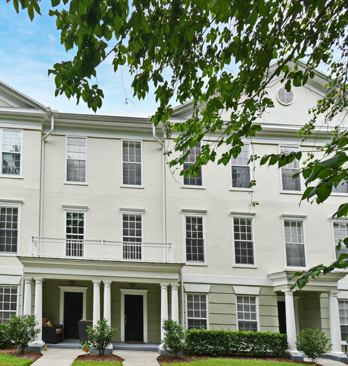 Beautiful townhome style property situated on a private spot surrounded by lush greenery. Layout features common spaces on the 2nd floor, 3 bedrooms and 2 full baths on the 3rd floor and a 4th bedroom/flex space on the ground floor. Living room, with built in features, is front facing and overlooks the conservation. Down the hall are a spacious formal dining room with more built ins, and a kitchen. The kitchen features granite countertops, many cabinets, and a sizeable eat-in nook. Most appliances are less than 5 years old. A convenient half bath is on this level. The 3 upstairs bedrooms all have walk in closets. The primary bedroom, also conservation facing, is generously sized with a tray ceiling and en-suite bathroom elegantly designed with dual granite-topped vanities, garden tub, and separate shower. This home has a convenient 2 car attached garage, granting tons of extra space, leading into the ground level with flex space that can be a 4th bedroom, home office, or any versatile extra room. Roof is less than 5 years old; One HVAC unit was replaced in 2022, and the other unit was only replaced last year! This unit is in a fantastic location, just steps to the Georgetown clubhouse with fitness center, tennis/pickleball courts, and resort style pool. You are also just a short drive to downtown Celebration with its shops and restaurants, and I4 and SR 417.