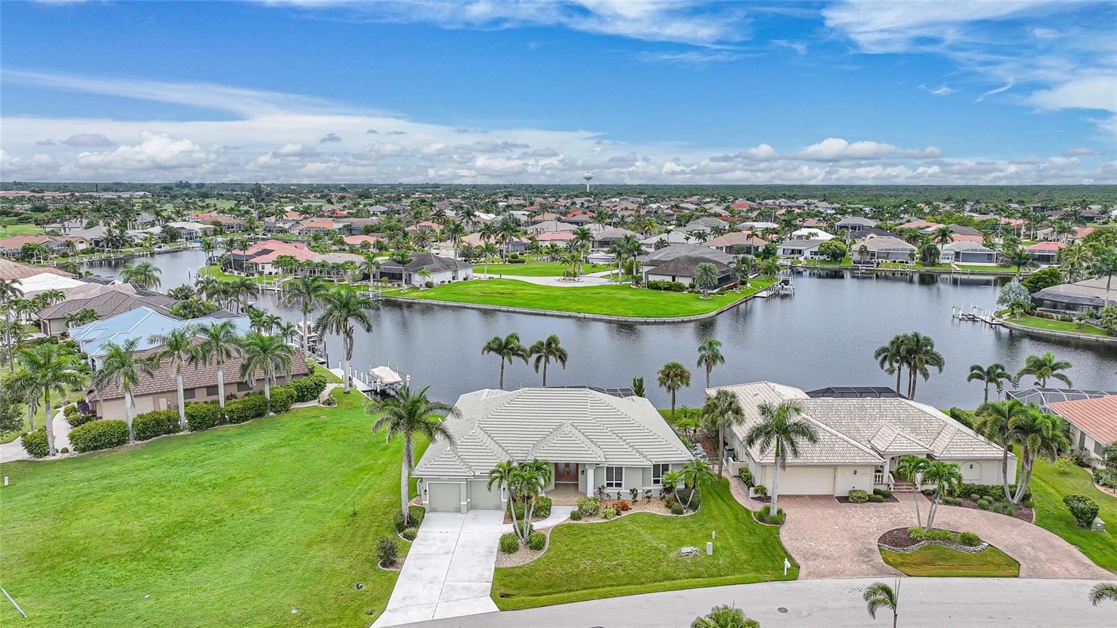 Welcome to Your Florida Paradise at 3932 Madrid Ct
Nestled in one of Punta Gorda’s most sought-after neighborhoods, this impeccably maintained 3-bedroom, 3-bathroom pool home offers the perfect blend of luxury, comfort, and waterfront living. Priced at $785,000, this residence delivers a lifestyle that captures the essence of Florida paradise.
From the moment you step inside, you’re greeted by soaring high ceilings and a bright, open floor plan that creates a sense of elegance and space. The split-bedroom layout ensures privacy, while tile flooring flows throughout the main living areas, complemented by plush carpet in the bedrooms for added comfort.
At the heart of the home, the expansive living and dining areas open seamlessly to the outdoors, where your private retreat awaits. A sparkling pool and spa combo invites you to unwind under the sun or host unforgettable gatherings. Overlooking a serene canal, the backyard extends to a concrete dock that spans the entire length of the lot, complete with a boat lift—making it effortless to set off on your next boating adventure.
This home has been lovingly cared for and thoughtfully designed for both everyday living and entertaining. Whether you’re enjoying a quiet evening watching the sunset from your lanai or welcoming guests for a waterfront dinner, the atmosphere is always one of sophistication and relaxation.
Located in a prestigious luxury neighborhood, this property combines an enviable location with timeless features, ensuring it stands out in today’s market. With its meticulous upkeep, spacious design, and unparalleled waterfront amenities, 3932 Madrid Ct isn’t just a home—it’s a destination.
Experience the best of Florida living in your own piece of paradise.