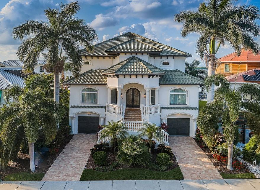 EXTENSIVELY UPDATED AND UPGRADED IN THE LAST THREE YEARS, THIS MAGNIFICENT COASTAL WATERFRONT MASTERPIECE OFFERS A BRILLIANT CUSTOM DESIGNER FLOOR PLAN AND DAZZLING CONTEMPORARY FINISHES THROUGHOUT!  Elegant cast stone exterior appointments and lush landscaping welcome you to an inspiring estate with lavish woodworking, gorgeous marble/walnut floors, incredible lighting, exquisite window treatments and beautiful waterviews.  A distinguished copper double door entry introduces a huge foyer with towering 22ft-high ceilings, sitting area and a striking modern glass wine room with tumbled-marble wall.  Your extraordinary open-concept, gourmet kitchen boasts superb quartz surfaces, fabulous coastal-white wood cabinetry, Viking SS appliances, DCS gas cooktop, island prep center, a large wrap-around island bar and a superb butler’s pantry with separate wine and beverage chilling.  45ft-wide great room provides a fine gas fireplace, posh wetbar and terrific views of the waterfront.  Step out to the spectacular 1175 sqft covered entertainment deck (with travertine marble floors) and take-in its jaw-dropping luxury outdoor kitchen and 9-seat wrap around bar, massive dining/seating areas, separate gas fireplace w/seating, 2 media stations and splendid full size pool bath!  1st level guest bedrooms/office are supported by an elegantly full bath.  Upstairs, you’ll discover an extraordinary owner’s suite with beautiful contemporary elements, dedicated seating area w/fireplace & media center, a superb walk-in closet system, Juliet interior balcony and a 25ft-wide, 350 sqft exterior balcony overlooking Tampa Bay.  Owner’s bath enjoys dramatic minimalistic aspects that convey a luxurious, indulgent appeal – dual vanities, dedicated cosmetics center, oversized soaking tub with intricate tiled wall, and exceptional multi-head walk-in rain shower with electronic temperature control.  2 additional upper level bedroom suites (one overlooking the waterfront and opening to the balcony) are oversized with graceful full baths.  Out back, you’ll love the multi-level pool lounging area, the pebbletech pool with elevated hot tub and cascading waterfalls, and the plush landscaping with soaring Royal Palms.  Your waterfront provides an updated seawall, composite dock, large sitting area, and boat/jet ski lift.  This astonishing home offers luxury extras that must be seen to be appreciate.  An outstanding estate value in a great location!  Dimensions are estimates, buyer to verify....Flood insurance is $681 / year.