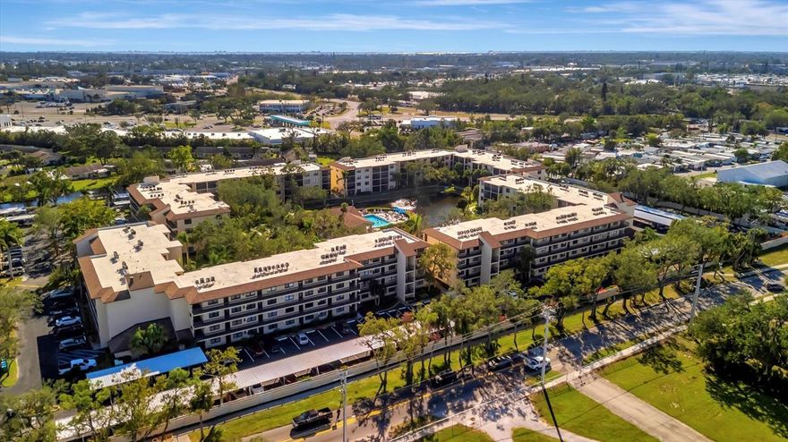 This beautifully renovated, turn-key furnished condo is a hidden oasis in the heart of Bradenton, with location as a standout feature. It offers easy access to Sarasota, Anna Maria Island, Gulf beaches, Bradenton’s keys, I-75, and downtown. This spacious 1-bedroom, 1.5-bath home, just under 1,000 square feet, is filled with high-end upgrades and comes completely furnished, including all Coastal décor, linens, and kitchenware—making it truly move-in ready. Quality tile plank flooring flows throughout, enhancing the clean, modern design. The extended kitchen is a showstopper, featuring an expansive quartz-topped island that blends style and function—perfect for meal prep, casual dining, or entertaining. Additional upgrades include a designer backsplash, soft-close drawers, raised soffits, and stainless steel appliances, offering both elegance and practicality. Stylish plantation shutters on the front and back windows, along with center-opening textured vertical blinds, add to the long list of extras. Upgraded lighting, outlets, and fans elevate the contemporary ambiance, while a front-door sliding screen allows for refreshing cross breezes. This top-floor unit with no neighbors above enjoys peaceful living with an abundance of natural light and serene water views, accompanied by the soothing sounds of a fountain. The lanai, finished with matching wood plank tile, overlooks lush landscaping, creating a peaceful retreat. Situated in Woodpark at DeSoto Square, a gated 55+ community, residents can enjoy amenities like a heated pool, spa, and scenic walking paths around the ponds. The building is pet-friendly and includes designated parking plus a storage space for beach gear. With its unbeatable location and tasteful Coastal-inspired design, this home is the ideal Florida getaway, close to Sarasota’s cultural offerings, Bradenton’s Riverwalk, and Tampa’s vibrant attractions.