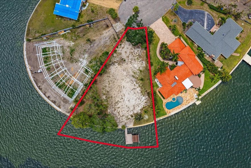 Set at the quiet end of an exclusive no-through street, 4838 Paradise Way S. represents a rare opportunity to create your spectacular waterfront home in one of St. Petersburg’s most desirable boating locations. An exceptional pie-shaped lot spans .35 acres and offers an impressive 160 feet of deep-water frontage, complete with newer composite dock with boat lift and jet ski platform, in place. Fish directly from your dock, and enjoy the dolphins playing in the surrounding waters, and relax in the your peaceful and private waterfront haven.
Facing southeast, the property is perfectly positioned to capture glorious morning sun across wide-open water views. The previous structure has been completely cleared, allowing for a seamless start to construction. Ready to design and build your custom waterfront estate, tailored to your vision and lifestyle. 
Despite its serene and secluded setting, the property is remarkably close to the energy and excitement of downtown St. Petersburg — just a 10-minute drive away, not much more by powerboat.  Enjoy the city’s vibrant cultural scene, renowned waterfront parks, acclaimed dining, boutique shopping, galleries, museums, festivals, open-air entertainment, and the iconic St. Pete Pier. The city’s famous murals, which adorn buildings throughout downtown, add to the unique artistic spirit that has made St. Petersburg one of Florida’s most sought-after coastal destinations. Coming in the near future is an expansion to the Old South East waterfront, promising further boat moorings, dining and entertainment venues to complement residential developments.
Come view this rare combination of tranquility, boating access, expansive waterfront, and proximity to one of Florida’s most dynamic downtowns.  Note: Be aware this is a freshly cleared parcel. Uneven surface conditions exist due to clearing. Proper footwear is recommended.Any Visitor to this vacant lot agree and acknowledge that they shall use due care in their entry upon the property and not undertake any act that may result in injury.