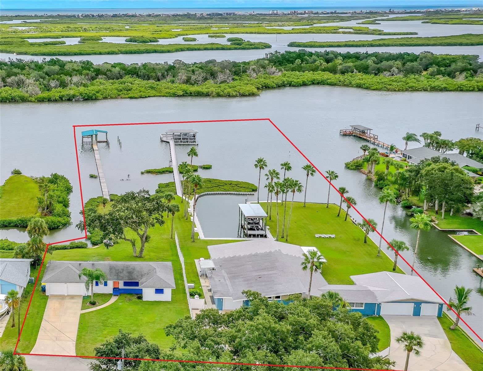 THIS OFFERING IS FOR 2-RIVERFRONT HOMES. TOTAL LAND MASS IS 1.36 ACRES WITH RIVERFONTAGE MORE THAN 600 FT. IN THE CITY OF EDGEWATER IT ALLOWS SHORT TERM RENTALS. LIVE IN ONE RENT THE OTHER OR CONNECT BOTH HOMES FOR A GREAT FAMILY COMPOUND. THIS DIRECT RIVERFRONT PARADISE IS BIG ENOUGH TO BE YOUR OWN MINI MARINA AND FAMILY RETREAT; LOTS OF RIVERFRONT DOCKAGE & A PRIVATE LAGOON. LOTS OF SEA WALL, PLENTY OF SPACE TO PARK BOATS, JET SKIS & EVEN YOUR FRIENDS BOATS. THREE HIGH END BOAT HOUSES AND THREE BOAT LIFTS. RIVERFRONT LIFT WILL HOLD 10,000LBS WITH A 35+FT BOAT. BOATHOUSE AND LIFT HAS TV HOOKUP, ELECTRIC, WATER & USB PORTS, MOOD LIGHTING, & LOTS OF SEATING FOR ENTERTAINING OR JUST WATCHING THE BEAUTIFUL SITES ON THE RIVER. THE LAGOON HAS AN UNCOVERD BOAT LIFT & A COVERED BOAT HOUSE AND LIFT. THE NEW STARCRAFT TRI TUNE PONTOON BOAT WITH 200 HP YAHAMA MOTOR COULD BE NEGOTIATED IN SALE. THE LARGER HOME IS BEAUTIFULLY DECORATED AND HAS A LARGE OPEN FLOOR PLAN & A MAJOR RENOVATION INCUDING CUSTOM KITCHEN, WITH LOTS OF STORAGE, QUARTZ COUNTER TOPS, & OVERSIZED KITCHEN ISLAND. TASTEFULLY DESIGNED WITH CROWN MOLDING AND CUSTOM DOORS AND WINDOWS. THE LARGE MAIN BEDROOM HAS EASY ACESS TO THE HOT TUB/JACUZZI ROOM. THE MAIN BEDROOM HAS CUSTOM BATHROOM WITH HIS & HER SINKS, TUB & SHOWER. THE THIRD BEDROOM COULD BE A MOTHER-IN-LAW SUITE AS IT HAS A SEPARATE ENTRANCE & ITS OWN ENSUITE. THE HOME HAS A VERY LARGE WORKSHOP WITH A DOOR OUT TO THE YARD, PLUS AN OVERSIZED 3-CAR GARAGE WITH CUSTOM BUILT IN STORAGE. THE 3-CAR GARAGE HAS GARAGE DOORS ON THE FRONT AND ONE GARAGE DOOR THAT LEADS TO THE RIVER. THERE IS A SEPARATE ADDITIONAL 1 CAR GARAGE WITH CUSTOM CABINETS FOR STORAGE & IT HAS ACCESS FROM THE LAUNDRY & A DOOR TO THE OUTSIDE. THE 65 FT GREAT ROOM HAS CUSTOM WINDOWS WITH GREAT RIVER AND LAGOON VIEWS. CUSTOM UP & DOWN SHADES GIVES YOU PRIVACY AS WELL AS ALLOWING SUNLIGHT IN OR OUT. ALL NEW CUSTOM WOOD FLOORING, TV AND ELECTRIC OUTLETS EVERYWHERE. FULL HOME GENERATOR, SPRINKLER SYSTEM, SECURITY CAMERA SYSTEM WITH 11 CAMERAS. ELECTRONIC DOUBLE GATE & STORAGE UNIT 35 X 20. THE SECOND HOME IS FRESH AND MORE THAN FUNCTIONAL. CUSTOM DESIGNED COUNTERTOPS HAVE BUILT-IN HIDDEN ELECTRIC & USB OUTLETS. LOTS OF SPECTACULAR DRAWER SPACE WITH INSERTS THAT WILL KEEP EVERYTHING ORGANIZED. SEE BEAUTIFUL VIEWS OF THE RIVER THROUGH THE LARGE CUSTOM-MADE HURRICANE RATED WINDOWS. THIS HOME HAS A LUXURIOUS STYLE THAT USES ORDERLY ELEMENTS TO CREATE BEAUTIFULLY PROPORTIONED SPACES FULL OF COLOR WITH A SENSE OF ENERGY & VIBRANCY. ALL NEW APPLIANCES, CUSTOM CEILING FANS, INSIDE LAUNDRY, LARGE TILED BATHROOMS WITH GLASS SHOWER ENCLOSURES & MANY MORE UPGRADES INCLUDING NEW INSULATION THAT DECREASES UTILITES AND A SPRINKLER SYSTEM ON A DEEP WATER WELL. THE OVERSIZED TWO CAR GARAGE IS A BONUS AND COULD BE CONVERTED TO A FAMILY ROOM, ADDITIONAL BEDROOM SPACE OR WORKSHOP PLUS GARAGE. THIS ONE-OF-A-KIND PROPERTY IS LOCATED IN A CUL-DE-SAC COMMUNITY WITH DEEDED ACCESS TO A BOAT LAUNCH. ;Water: City