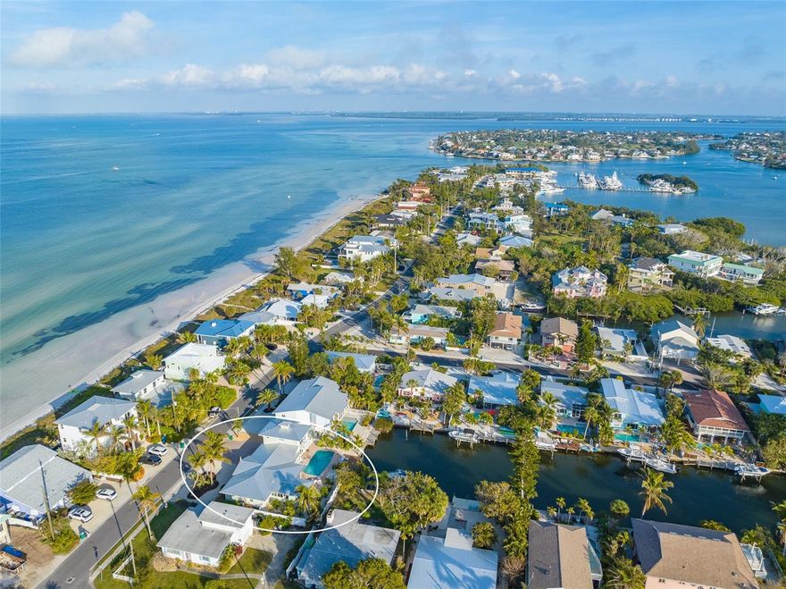 “Living the Dream” embraces all that is the beauty, joy, and adventure of Anna Maria Island: Low Rise, Low Key, Friendly Vibe, and a Water Wonderland. This beautifully renovated 4 bedroom and 3 bath pool home on a Bimini Bay canal offers you a full-time island home, second home, or investment rental opportunity. This is a successful vacation rental home on the quiet North End of Anna Maria Island that gives you easy access to the nearby neighborhood restaurants, shops, bars, marinas, and the Anna Maria City Pier. Plus the path to direct Tampa Bay water access is directly across the street. And the Gulf beaches are just a bike ride away. This canal gem is accented by an awe-inspiring view down the canal where memorable sunsets will inspire you throughout this home. The Open Plan embraces a spacious Great Room, Kitchen, and enclosed Lanai. The split bedroom plan accommodates multigenerational guests with two bedrooms and a full bath next to the Great Room and one twin bedroom and bathroom on the east side of the home plus a media room with direct access to the pool deck. Then up to the private Master Bedroom with en-suite master bath, walk-in shower and sitting area. And the private deck overlooks the beautiful canal and resort entertainment area which includes the Pool deck, Boat Deck, Outdoor Bar and Grill area. And you can control the temperature of your pool, warm or cool, with your cellphone. The new dock accommodates up to a 25 ft. boat. This is Island living at its best. Please Contact us today for your private tour.