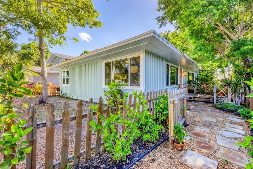 Welcome to this truly spectacular 1929 bungalow in the desirable Indian Beach neighborhood—where timeless character meets thoughtful modern updates. From the moment you step inside, you’ll be captivated by the abundant natural light streaming through large windows, highlighting the home’s warm and inviting atmosphere. Gleaming original wood floors run throughout, adding richness, history, and undeniable charm. The spacious open floor plan is anchored by a beautiful fireplace, creating an ideal setting for both everyday living and entertaining. This home offers THREE COMFORTABLE BEDROOMS AND TWO WELL-APPOINTED BATHROOMS.There is even space for the home office! The beautifully updated kitchen looks out over the living area of this “open plan” and features stainless steel appliances and plenty of workspace, along with the added convenience of an interior utility room complete with washer and dryer. Additional upgrades and improvements include IMPACT RESISTANT WINDOWS (Including the skylight!) installed in 2025, a NEWER ROOF (2021) and a central AC system installed in 2023. Set beneath a canopy of mature trees, this home is located in one of Sarasota’s most established and culturally rich neighborhoods. Enjoy close proximity to downtown Sarasota and renowned institutions such as the Ringling Museum of Art, Ringling College of Art and Design, the historic Asolo Theater and the Sarasota Ballet. Just two miles north of downtown, you’re just a short drive over the Ringling Causeway to the pristine beaches of Lido and Longboat Key. University Parkway, the Sarasota Bradenton International Airport and the UTC shopping and dining district are also nearby, offering endless convenience and lifestyle amenities. This is a rare opportunity to own a bright, beautiful, character-filled home in one of Sarasota’s most sought-after locations.