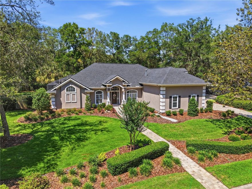 In the heart of Haile Plantation, this beautifully updated 4-bedroom home with a dedicated office blends timeless style with everyday comfort. Classic Mullican hardwood floors, plantation shutters, and thoughtful upgrades throughout create a home that feels both warm and refined. The gourmet kitchen is a true standout, featuring high-end appliances, a Sub-Zero refrigerator, and a layout designed for both everyday living and entertaining. Step outside to your screened pool framed with beautiful travertine and fully fenced backyard, a private setting for relaxing weekends, family gatherings, or quiet evenings at home. Practical upgrades add even more value, including a 3-car garage with a Penntek coated floor, Autel Electric Vehicle charger, custom paver driveway and walkways, plus fresh landscaping that adds to the home’s curb appeal. Located in one of Gainesville’s most recognized communities, Haile Plantation offers a lifestyle people move here for, with tree-lined streets, walking trails, golf, nearby shops and restaurants, and convenient access to top-rated schools, UF, and UF Health.
