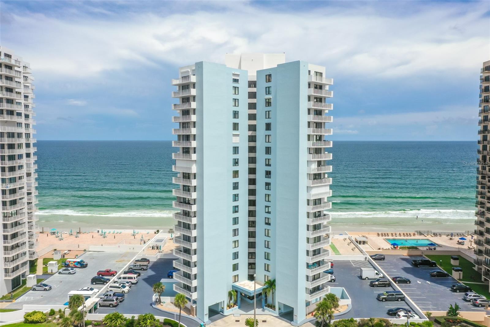 This stunning vacation rental condominium boasts over 100,000 in exquisite upgrades, including a brand-new kitchen and baths. Offering 1,141 square feet of beautifully designed space with a split floor plan and coveted southern exposure, this 2-bedroom, 2-bathroom retreat combines elegance, comfort, and coastal charm. The upgraded kitchen is a standout feature, complete with soft-close white cabinetry, granite countertops, and a glass backsplash reminiscent of ocean waves. Stainless steel appliances, recessed lighting, and a smooth ceiling enhance the upscale ambiance, while the oversized island serves as the perfect spot to enjoy your morning coffee.
The living room adds to the coastal charm with a shiplap accent wall, luxury vinyl flooring, and clean, contemporary lines that create a welcoming and stylish atmosphere. The primary bedroom offers breathtaking ocean views, recessed lighting, a contemporary ceiling fan, and both a spacious walk-in closet and a second closet. The guest bedroom, equally luxurious, feels like a second primary suite with serene décor and modern lighting. Both bathrooms are fully updated, with the primary bath featuring a spa-inspired glass shower equipped with a rainfall showerhead, multi-jet shower tower, and a bench seat. The elegant design includes Carrara white marble hexagon mosaic tile flooring and a subway tile surround.
Beyond the condo’s interior, residents enjoy a host of resort-style amenities. These include a fitness center, social and billiard rooms, sauna, large pool with a sun deck, private beach access, and secure underground parking for one car, with additional spaces available on the upper deck. The community also offers outdoor grills, shuffleboard courts, party and game rooms, a hobby shop, and a library. Conveniently located across the street from city offices, emergency services, Publix, Walgreens, and a community center, the condo is just steps away from the Oceans Executive Golf & Tennis Club.
This is a 2-month minimum rental in a pet-free building, offering the perfect coastal escape for those seeking luxury, convenience, and relaxation.