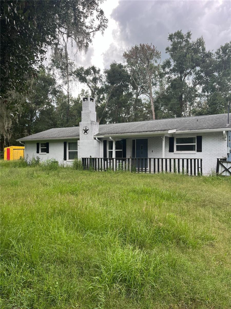 Short Sale. Welcome to 5419 Cyril Drive, Dade City, FL 33523—a beautifully maintained 3-bedroom, 2-bathroom home nestled on 2.6 acres of scenic land. With its perfect blend of comfort, charm, and functionality, this property offers a peaceful escape with plenty of room to roam.
Step onto the inviting front porch and into a spacious interior adorned with gorgeous ceramic tile flooring throughout. The open-concept living area features a stunning brick fireplace, creating a warm and welcoming space to relax or entertain. The kitchen is both functional and stylish, complete with stainless steel appliances, ample counter space, and a tray ceiling that adds a touch of elegance.
The primary bedroom suite offers a private retreat with a walk-in closet and an en suite bathroom, while two additional bedrooms provide comfort and flexibility for family or guests.
Outside, the property is a dream for hobbyists and outdoor lovers alike. Enjoy a pole barn, two sheds—one finished with electric, A/C, and insulation, ideal for a workshop, office, or creative space—and a covered pavilion with slab flooring, perfect for gatherings. There's also a small horse stable and fenced-in area ready for farm animals or pets.
Located just 4 minutes from I-75 and only 8 minutes from the Croom ATV trails, this home is close to outdoor adventures, including the Pioneer Florida Museum, Withlacoochee State Trail, Epperson Lagoon, and the Giraffe Ranch. Shops, restaurants, and parks are also within easy reach.
Don’t miss your chance to own this one-of-a-kind Dade City gem!