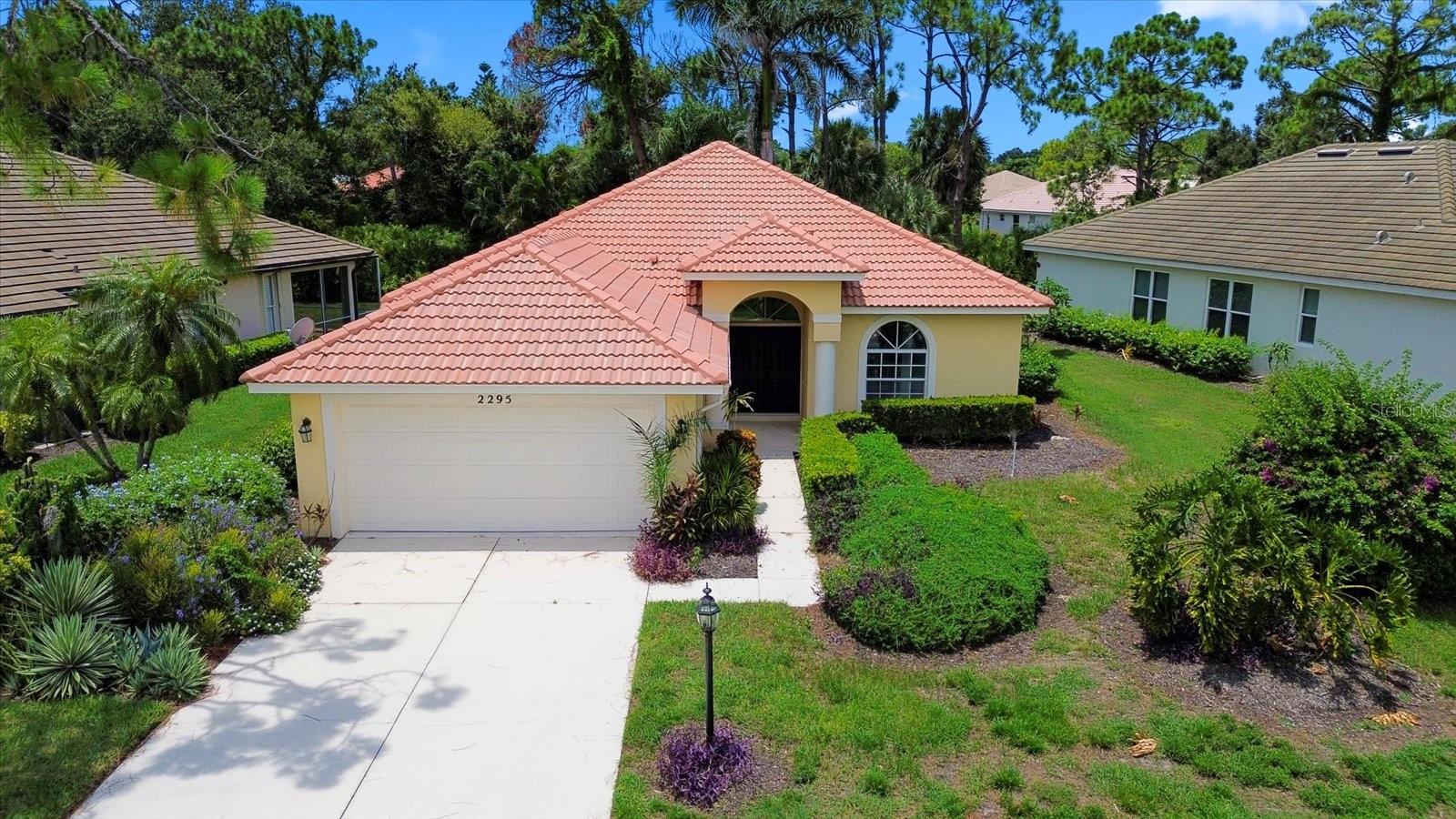 One or more photo(s) has been virtually staged. Welcome to 2295 Harrier Way – where elegance, comfort, and convenience come together in perfect harmony.
This beautifully updated home offers a timeless design with carefully curated finishes. Nestled in Falcon Trace, the sought-after maintenance-free enclave of Calusa Lakes, this residence combines sophistication with everyday ease.
Set on a spacious lot surrounded by lush vegetation and preserved woodlands, the property provides both natural light and serene privacy. Step inside to an open, thoughtfully designed floor plan with soaring ceilings and brand-new marble-look porcelain tile flooring throughout.
The heart of the home is a modern chef’s kitchen, complete with quartz countertops, stainless steel appliances, and a peninsula that opens to the central living room—perfect for both entertaining and everyday living. A bright dining area, embraced by windows overlooking the natural surroundings, enhances the sense of connection to the outdoors.
The primary suite is generously sized, offering room for a king bed with additional furnishings, along with dual walk-in closets. The ensuite bath is a luxurious retreat, featuring a new marble-tile shower, stone-topped vanities, updated fixtures, mirrors, and lighting. The split floor plan ensures privacy, with a spacious second bedroom and fully remodeled guest bath on the opposite side of the home. A versatile third room—accessible through French doors—can serve as an office, library, or guest bedroom.
Additional features include a large two-car garage with a workbench, laundry area with washer, dryer, and utility sink, plus direct side-door access. Outside, the screened lanai opens to a completely private backyard framed by mature Florida landscaping—beautifully maintained year-round by the association.
Living here feels like resort-style luxury. Just a short stroll away, residents of Falcon Trace enjoy an exclusive heated pool, with additional access to the main Calusa Lakes pool. The gated community also offers a clubhouse with restaurant and bar, tennis courts, and an 18-hole golf course, all surrounded by lakes, waterfalls, and tropical scenery.
Ideally located between Sarasota and Venice, you’ll be just minutes from I-75, shopping, dining, boating, and some of Florida’s most famous beaches—including Nokomis Beach and Siesta Key, known for pristine white sands.
2295 Harrier Way is more than a home—it’s a lifestyle. Experience the perfect balance of elegance, tranquility, and convenience in one of Sarasota County’s most desirable communities.
