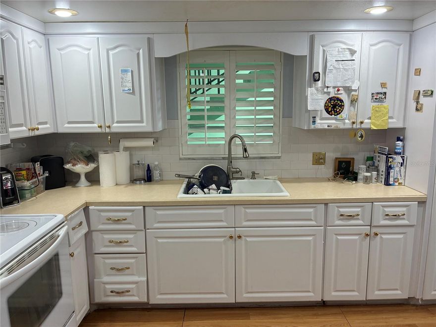 Spacious 2-bedroom, 2-bath end-unit condominium in a peaceful 55+ community featuring mature oak trees and beautifully maintained landscaping. With windows on three sides, this second-floor residence is filled with natural light and offers an airy feel throughout. The generously sized rooms provide more living space than typically found in a modest condominium, creating excellent potential for comfortable year-round living or seasonal enjoyment.

The kitchen is functional and ready for everyday use, while the bathrooms and carpeting offer an excellent opportunity for updates to match your personal style and add value. One assigned off-street parking space is included for convenience. Located just one flight up, this unit combines privacy, light, and potential in a desirable community setting.

The seller is motivated to sell quickly, and will consider all offers. Don’t miss this opportunity to make this bright and spacious condo your own.