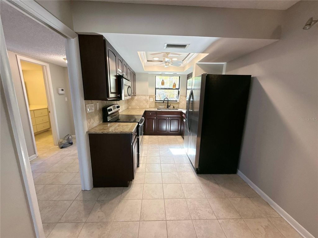 Photo of 13516 Palmwood Lane, Tampa, FL 33618 (MLS # TB8471780)