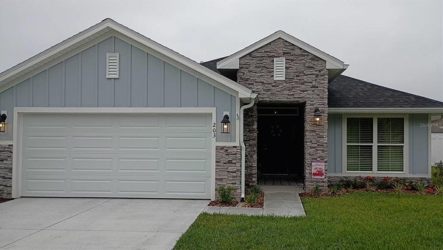 Affordable living in North Central Florida near the historic Suwannee River attractions, or an afternoon drive to the coast or the attractions in Orlando. Enjoy a nearly new home in a medium-sized town with excellent shopping, including an indoor mall and modern hospitals less than 5 minutes away. The home could be an investment opportunity for leasing or Airbnb applications for those working remotely from home. The home is located in an area dotted with lakes for recreation and fishing, with Ichetucknee Springs within 30 minutes. The décor is Florida “Coastal-Farmhouse” in style; all furnishings are available for purchase to discerning buyers.

The house includes many needed features to be a “completed home” that builders rarely provide: Open floor plan; entire home is light and bright with 10-foot ceiling height in main area. Kitchen and baths with attractive granite counters, white solid wood cabinetry, and Frigidaire® appliance package. Lots of luxury vinyl tile flooring in entry, kitchen, laundry room, and bath areas; warm carpeting in bedrooms. Many other desired optional features including: High-end $10k stone fascia package on front of home. Exceptional building lot with w-i-d-e frontage. 6’ white privacy fence on both sides and rear yard. Master bath with garden tub and separate tiled shower. Seamless 6” gutters, downspouts, and ground spats. GE Profile® front-load washer/dryer. Frigidaire® Gallery model side-by-side refrigerator/freezer. Pentair® reverse osmosis drinking water system for distilled water on tap in kitchen. Installed in-wall safe for valuables. 2” wood-look window blinds installed. ¾” brass-look matching curtain rods. Matching 90” window draperies. Designer chandelier replacements.

Exterior features durable Hardie® Board siding. Five (5) installed ceiling fan/LED light combos. 10-foot ceilings in main area, vaulted in others. Garage floor epoxied and built-in shelving added. Master bedroom retreat off of the living area with vaulted ceiling. Master bath dual-sink vanity with granite counter. 19 LED ceiling lights installed throughout. Garage entrance ramp for autos and 4” entry ramp at man-door. Garage includes attic pull-down ladder with floored storage above and electric door opener. Low HOA fee with considered amenities of: private community pool, tennis courts, basketball court, and playground for owner use. Currently, the house is adult-owned, smoke-free, and no pets; fresh and like-new condition.