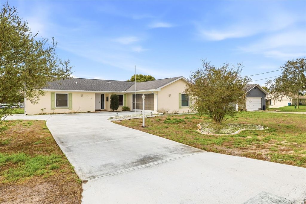 Photo of 12324 Drayton Drive, Spring Hill, FL 34609 (MLS # W7883839)