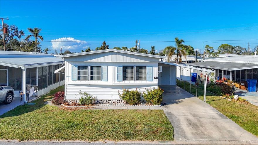 This LIGHT and BRIGHT, TASTEFULLY TURNKEY FURNISHED home features two bedrooms and 1.5 baths, with WOOD LAMINATE flooring throughout (except in the kitchen and bathrooms). It has no hurricane damage, except for a ridge vent replacement. The spacious primary bedroom can easily accommodate a king-sized bed and offers plenty of closet and storage space. The convenience of a half bath in the primary bedroom, with updated flooring and a new toilet installed in 2022, adds to the appeal. Awnings provide additional protection during storms, and the microwave is new as of 2024. With ample storage, including two sheds, this home also offers low dues, covering a heated community pool, pickleball, tennis courts, shuffleboard, and both water and sewer. Located in Fair Lane Acres, an active 55+ community in the heart of Bradenton, it’s just minutes from SRQ airport, local shops, restaurants, and the beautiful Bradenton beaches—perfect for a relaxed, carefree lifestyle!