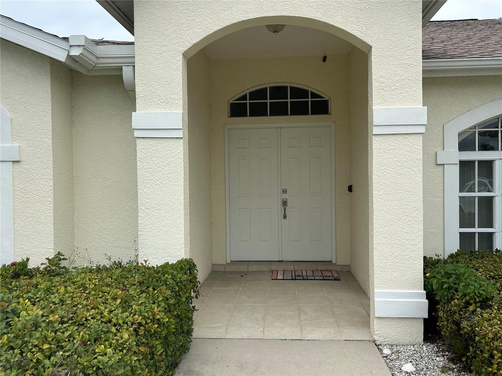 Photo of 435 Rotonda Circle, Rotonda West, FL 33947 (MLS # D6148997)