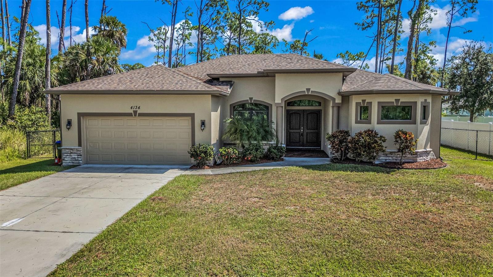 SPACIOUS 3 Bedroom, 2 Bathroom, 2 Car Garage home with a Family room located in North Port. NO HOA FEES AND NO FLOOD REQUIRED! CLICK ON THE VIRTUAL TOUR LINK 1 FOR THE VIDEO AND VIRTUAL LINK 2 FOR THE 3D TOUR. Featuring a bright & airy floor plan, tile flooring throughout, high tray ceilings, crown molding and MUCH MORE! The large living room has a glass slider that fills the space with natural light, while the connected dining room flows seamlessly to the kitchen, making this home perfect for entertaining. The kitchen offerd ALL stainless steel appliances, granite countertops, abundant workspace, plenty of cabinetry for storage, and a breakfast bar for casual dining. Just off the kitchen, the family room provides extra space for relaxing or entertaining, with a slider leading to the lanai. The primary suite is a peaceful retreat with dual walk-in closets and a spacious en-suite bathroom featuring split vanities, a central soaking tub, and a walk-through Roman shower. The split bedroom floor plan provides excellent privacy for guests with two comfortable bedrooms and a full guest bath. Step outside to the covered lanai, the perfect spot to enjoy your morning coffee or unwind with your favorite evening beverage. The fully fenced backyard is ideal for kids or pets, with room to add a garden, pool, or create your own outdoor oasis. Conveniently located close to I-75 and US-41 for easy access to local shopping, and dining, as well as Cool Today Park welcoming the Atlanta Braves Spring Training, the North Port Aquatic Center, and the newly built downtown Wellen Park amenities. Schedule your showing TODAY!