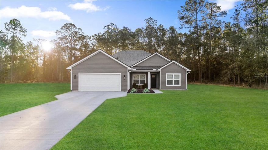 One or more photo(s) has been virtually staged. *Seller willing to contribute towards Buyer’s Closing Costs - Home Warranty Included* Wake up to quiet mornings in Keystone Heights, where space, nature, and comfort come together. This stunning new construction home is located feet away from Lake Washington. Imagine sipping your coffee or tea on the back porch with a view of the water while the neighborhood slowly comes to life and the lake breeze drifts by. Step inside to an open, light-filled living space designed for modern living and effortless entertaining. The kitchen is the heart of the home, featuring quartzite countertops, upgraded stainless steel Samsung appliances, and clean, modern finishes that make everything from weeknight dinners to hosting friends feel special.Your private primary suite is a true retreat, complete with an oversized spa-style shower with dual shower heads, dual vanity with lighted & fog-free mirrors, as well as a walk-in closet. Both bathrooms provide the same thoughtful touches that elevate everyday routines. Tech features include a Simplisafe security system, Lift Master garage door opener with built-in camera and app capabilities, prewired for exterior camera and motion lighting, blocked & pre-wired for wall mount tv’s in both the living room and primary bedroom, and automated irrigation system. With nearly an acre to enjoy, there’s room to garden, entertain, park your toys, or simply enjoy the freedom of wide-open space—all while being just a 30-60 min drive to Jacksonville and Gainesville for even more, dining, shopping, and entertainment options.The furniture is available for purchase, making this home truly move-in ready. Enjoy the benefits of new construction with all the upgrades already done—no waiting, just living. Put this home at the top of your list and get ready to walk through the doors of your new home! Grass is currently in the process of being installed.