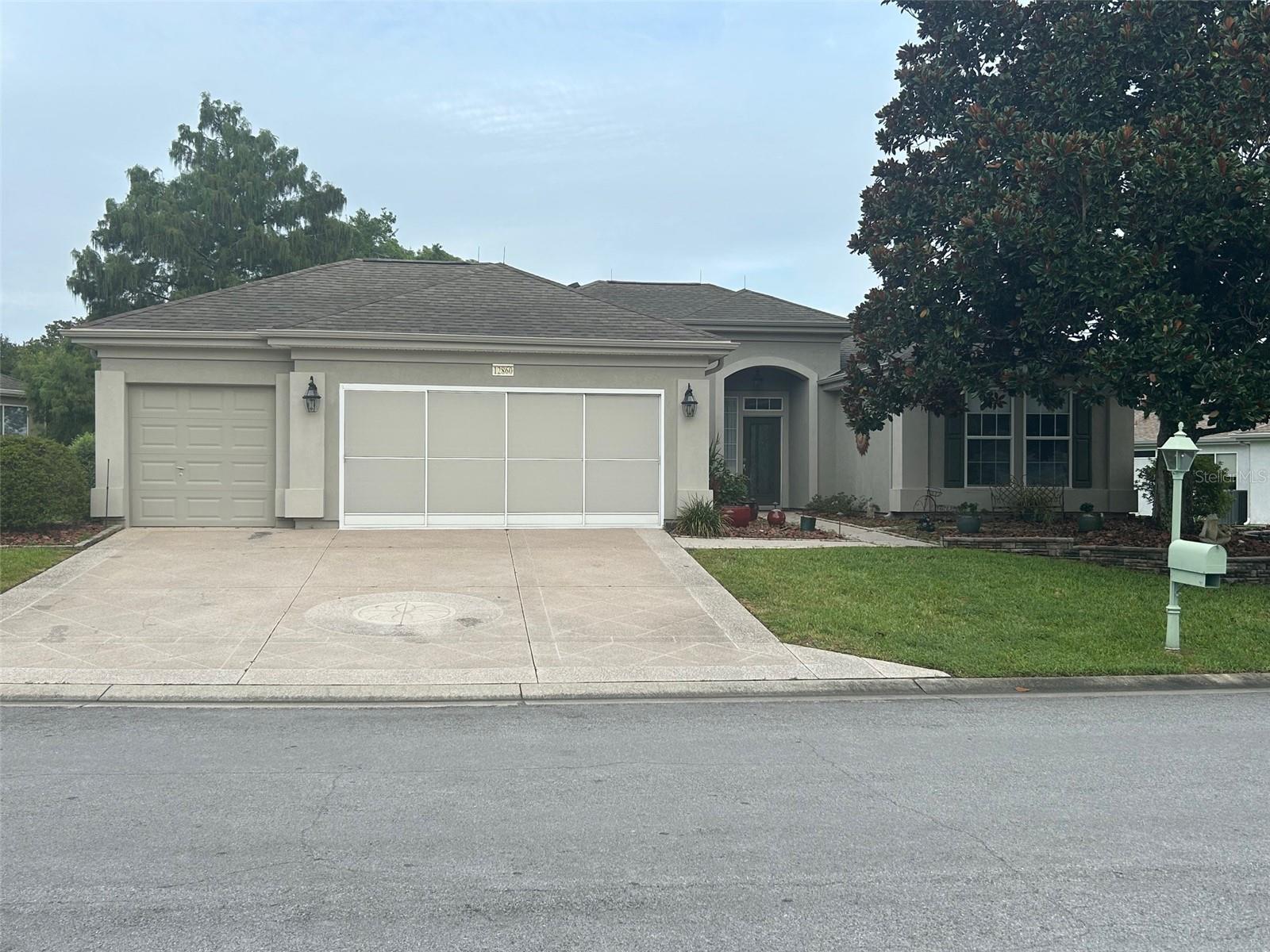 This Madeira Model pool home is located in the heart of Del Webb Spruce Creek Golf & Country Club. Boasting 2 bedrooms, 2 baths, plus a den/office area along with a renovated kitchen that features solid wood painted cabinets, premium granite counter tops, under cabinet lighting, solar tube, a new stainless-steel gas range with range hood, and breakfast bar all adjacent to the dining area. Enhanced touches such as crown molding and powered window shades. The Owner’s Bathroom has dual sinks and a tiled shower with glass enclosure. All floors in the home are tile with bedrooms having a wood grain finish. Ready for your enjoyment is an oversized screened lanai enclosing the pool area giving you an oasis to relax and enjoy the Florida weather. The Southeast facing home allows mornings to be cool to enjoy your coffee and ponder your day’s events while looking at your backyard. The afternoon is the perfect time for floating or swimming in the 6 ft deep kidney shaped saltwater pool. The pool is heated so that you can enjoy swimming even when the weather turns cool. This living space includes an outdoor kitchen and bar area, seating area with fire table, and table with chairs to enjoy eating outside (outdoor furnishing convey). This home combines comfort and style making it an ideal oasis. The 2-car garage with golf cart garage includes extra overhead storage for those holiday decorations, a small workshop, and tub sink. Don't miss this opportunity to own this wonderful piece of Florida. Schedule your private showing today and experience firsthand what makes this home so special.