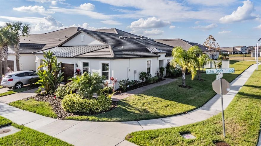 Beauiful spacious end unit villa in Medley Active Adult. For those better than 55 years young, presents an exceptional lifestyle just beyond the confines of your home. As a resident, you'll enjoy exclusive Clubhouse access with a full calendar of events daily! You will also enjoy a restaurant & bar, heated pool w/cabanas, ballroom, billiards room, card room, state of the art fitness center, pickleball & tennis courts, bocce ball, yoga, line dancing and private active adult events. PLUS included in your HOA is a 15-acre lagoon membership w/soft, sandy beaches including a swim-up bar, kayaking, paddleboarding, obstacle course, waterslides, corn hole games, and tons of community events! Be sure & invite friends or family to come along with you as you may gift them passes or pay a deeply discounted rate! This well maintained villa will please even the most selective buyers! Comprised of 2 spacious bedrooms, 2 Full Baths + an office/den, and 1 car garage. Your new home includes lots of upgrades including granite countertops with quartz island, plenty of upgraded lighting, stainless appliances and white cabinetry. Sliding glass doors lead to your fully screened lanai with a wonderful unobstructed view of your highly upgraded lush landscaping. Great spot to sit and relax and enjoy a cup of coffee or glass of wine! As you step inside, you'll be greeted by a seamless flow of open living spaces, making it ideal for both relaxation and entertaining. Get ready to make memories that will last a lifetime! Your dream home awaits; you will be enjoying the CAREFREE FLORIDA RESORT LIFESTYLE in your new home as quickly as you are able to move in! Gorgeous curb appeal on this block villa! Enjoy 42" Cabinets, and Walk-in Pantry in this gorgeous kitchen. Primary Suite with luxury vinyl flooring includes ensuite bath, soaking tub inside shower, dual sinks, grab bar for safety, private water closet, granite counter tops, walk-in Closet to keep you organized, and upgraded ceiling fans to keep you cool. A HUGE PLUS IS THERE IS PLENTY OF PARKING JUST STEPS AWAY! Pavered driveway with pavered walk way all the way to the front door! High-speed (ULTRAFI) internet, premium cable, yard maintenance & exterior painting and homeowners' insurance for structure are covered by HOA. The location of this residence is equally remarkable, situated in close proximity to premier shopping destinations, and an array of dining options, you'll find yourself immersed in a vibrant community that strikes a perfect balance between exclusivity and convenience. Ride your Golf Cart to the Clubhouse, Publix, restaurants, Farmers Market, Chick-fil-A, Banks, Starbucks, Nail Shops, and more! Close to Advent Health Hospitals, BayCare Hospital, Florida Medical Clinic, Wire Grass Mall, Tampa Premium Outlet Mall, Krate at the Grove, Sam's Club, Costco, Golf Courses & Movie Theater. Easy access to I75, 275, Tampa International Airport, Downtown Tampa, and Florida's amazing beaches. CDD IS ALREADY INCLUDED IN TAXES.