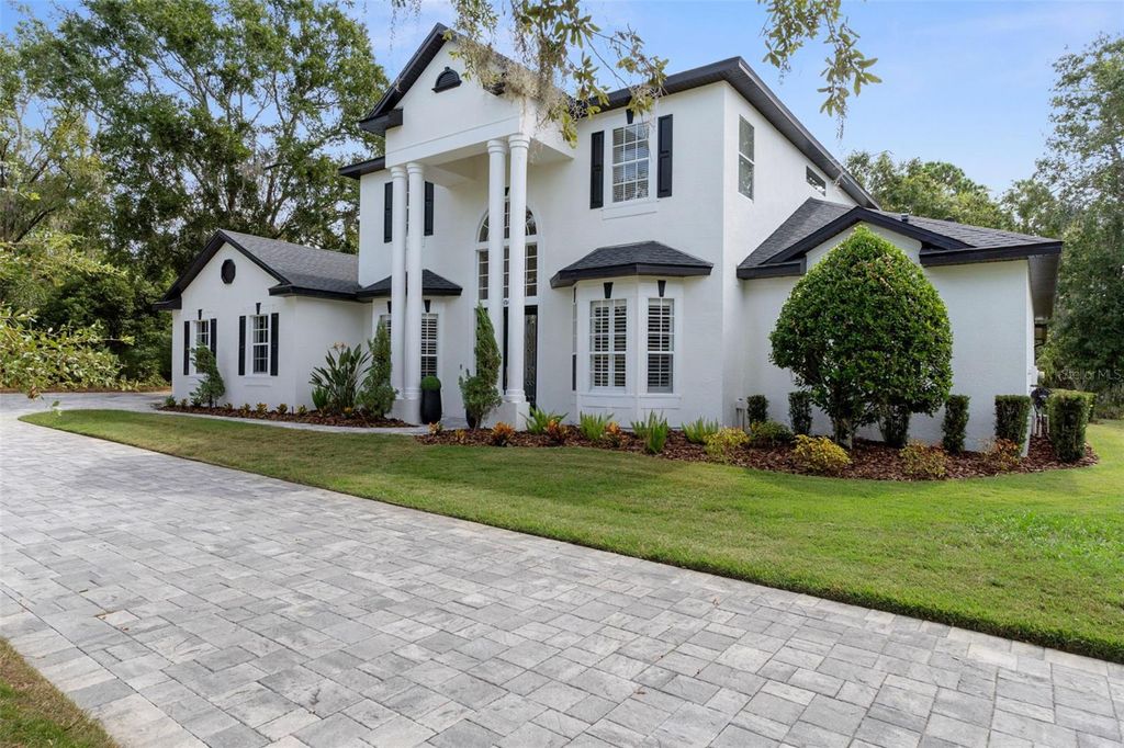 Photo of 6814 Magnolia Point Drive, Land O Lakes, FL 34637 (MLS # TB8429944)