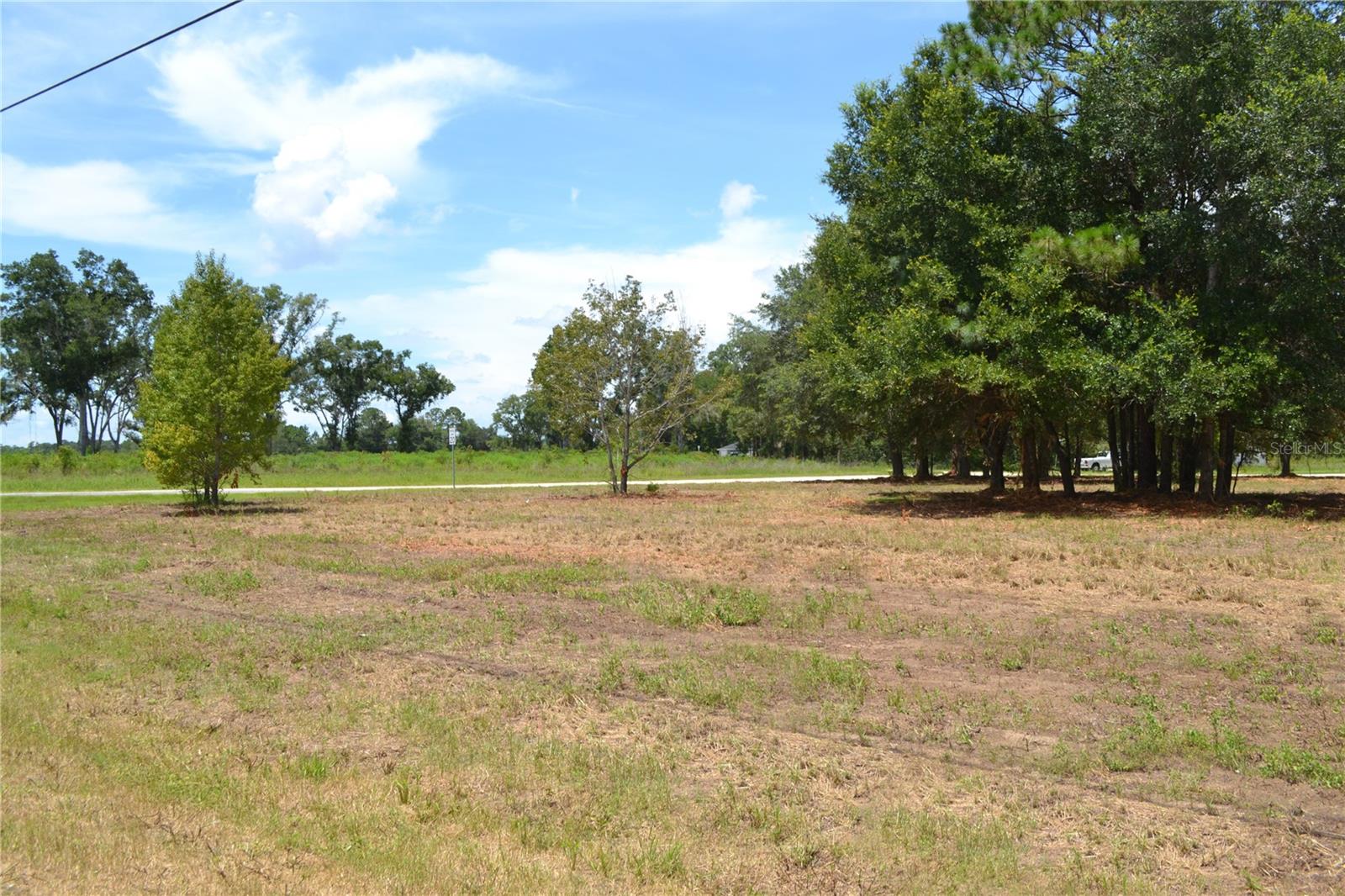 Located along the heavily traveled Highway 40 between Ocala and Dunnellon, this 1.86-acre B-4 zoned parcel offers strong development potential. With approximately 300 feet of highway frontage and mostly cleared land, the site is well-positioned for a range of commercial uses including gas stations, auto sales, or large-scale retail. Situated alongside a soon to be 4-lane stretch of Highway 40, the property benefits from steady traffic exposure and a rising local customer base. A solid opportunity for investors or developers seeking a visible, flexible site in a growth corridor!