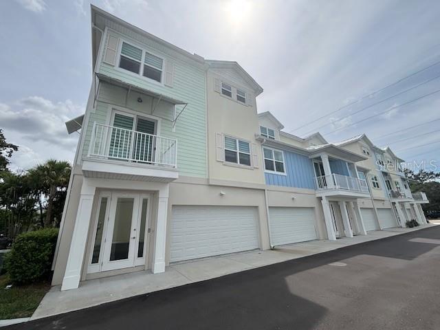 Long term, UNFURNISHED NEWER TOWNHOME. Three bedrooms with three full baths, four car tandem garage, elevator and three floors of new, new and new. First floor of this townhome consists of the garage, back patio, inside storage area and contemporary entryway. Second floor has the main living area with a modern open floorplan, kitchen includes stainless appliances, granite countertops and pantry, open to the living area, bedroom with full bath and laundry room with front load washer and dryer and utility sink. Third floor has another bedroom with ensuite bath, additional storage area and owners suite with large walk in closets, double sinks and lots of space and storage. Bright, light and airy throughout this entire space from top to bottom. All this is situated just minutes from downtown Dunedin for dining, festivals and fun. Minutes to Pinellas Trail, Honeymoon Island, Dunedin Beach and lot of good times! Available today. Community construction has been completed, upcoming pool with bath house is on the way.