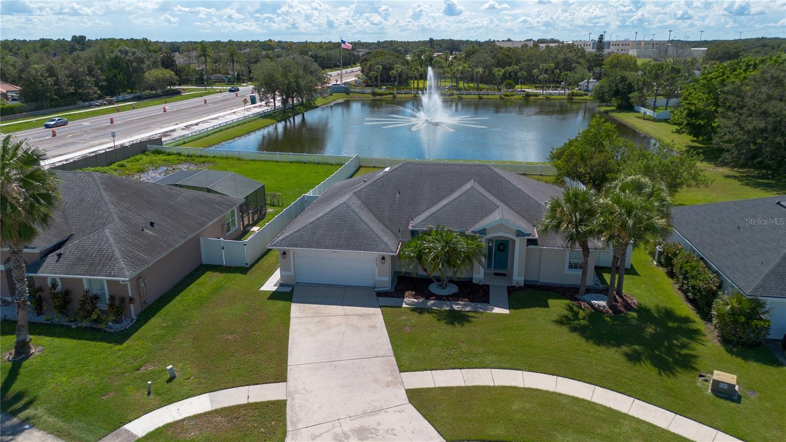 Beautiful Lakefront Home located on a Cul-de-Sac in the Gated community of Springlake Village. Inside, you’ll find a spacious open floor plan with vaulted ceilings, a great room, dining room, separate eat-in kitchen, and extended screened lanai perfect for entertaining. The kitchen overlooks the great room and features wood-grain tile flooring throughout, with the exception of the Primary Retreat, which has beautiful 3/4" engineered hardwood floors.
The Primary Bath includes dual sinks, a relaxing jetted garden tub, 2 walk-in closets, and a seamless glass shower enclosure. Additional upgrades include entire home freshly painted inside and out with Valspar Paint, 5" baseboards, and tall 3-panel sliding glass doors that flood the home with natural light.
Step outside to the oversized backyard and enjoy spectacular water views with fountain from the spacious lanai. This is ideal for gatherings and outdoor living. The home also includes a 2-car garage and seamless gutters. Community Highlights; Springlake Village offers resort-style amenities including: Electronic guard gate, Swimming pool & fitness center, Tennis courts & shuffleboard, Playground & recreation center.
All in a prime location near Lake Nona Medical Center, Orlando International Airport, Austin Tindall Regional Park, and with easy access to the 417 Expressway.