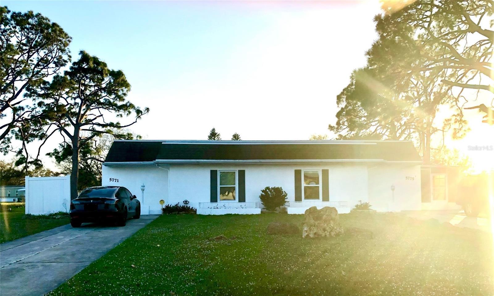 Welcome to 5771 & 5775 Gallatin Lane, a well-maintained duplex conveniently located near everything North Port has to offer—wonderful restaurants, shopping, Warm Mineral Springs, and just a short drive to Florida’s beautiful Gulf beaches. Sports enthusiasts will enjoy easy access to multiple spring training stadiums, including the new Charlotte County complex. Not in a flood zone.
Each side of this duplex features 2 bedrooms and 1 bathroom, a dine-in kitchen, a comfortable living room that opens to a private patio, and a convenient laundry room. Beautiful vinyl plank flooring runs throughout, paired with modern kitchens, and fresh interior paint in Benjamin Moore’s Chantilly Lace.
The property sits on a generous 0.47-acre lot, offering a large backyard ideal for outdoor entertaining. Public water and sewer add everyday convenience, and the new roof provides peace of mind for years to come. Utilities are separately metered.