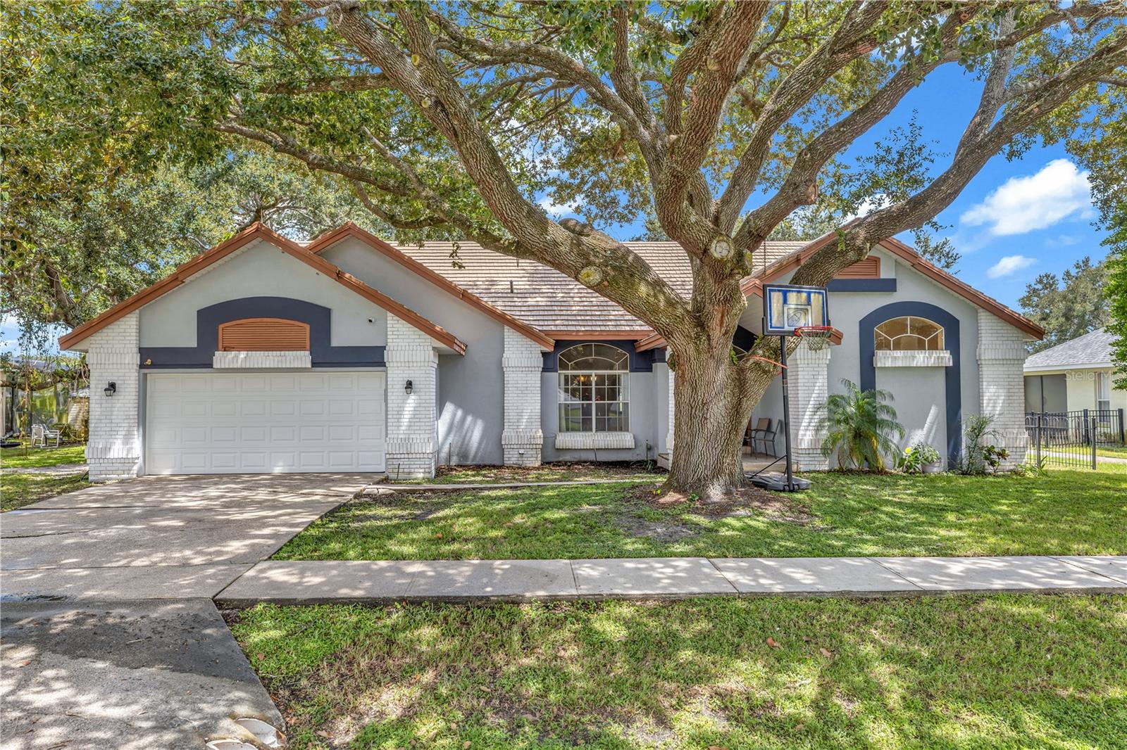 Welcome to 2827 Ballard Ave, a 4-bedroom, 3-bathroom home with 2,486 sq ft of beautifully designed living space, tucked inside the sought-after Wedgefield Golf Community. This home has been well-loved and thoughtfully updated, offering the perfect blend of comfort, function, and style. Step inside and you’ll be greeted by a spacious living room filled with natural light, framed by sliding glass doors that invite the outdoors in. The formal dining area sits just off the entryway, setting the stage for family gatherings and special occasions. The heart of the home is the open kitchen and family room—an entertainer’s dream—with even more sliding glass doors leading out to the massive L-shaped screened patio. Imagine hosting summer BBQs or evening get-togethers overlooking the 16th hole of the golf course—a backdrop that makes every day feel like a getaway. On one side of the home, three secondary bedrooms and two bathrooms are tucked away beyond the family room, creating privacy and space for everyone. On the opposite side, the owner’s suite is a true retreat, featuring dual vanities, two walk-in closets, and a spacious walk-in shower. This home has been beautifully maintained with thoughtful updates, including: Re-piped in 2019 New water heater (2020) New A/C & thermostat (2022) Metal roof with 50-year warranty (2004 install) New garage door opener (2023) Recessed lighting added to kitchen & baths (2024) Water treatment system + Rainsoft air treatment unit
Microwave (2 years old) & Freshly pressure-washed exterior. Wedgefield isn’t just a community—it’s a lifestyle. With its golf course, clubhouse, parks, and convenient location, it offers the perfect balance of recreation and relaxation. This incredible home is ready for its next chapter. Don’t miss the opportunity to make it yours!