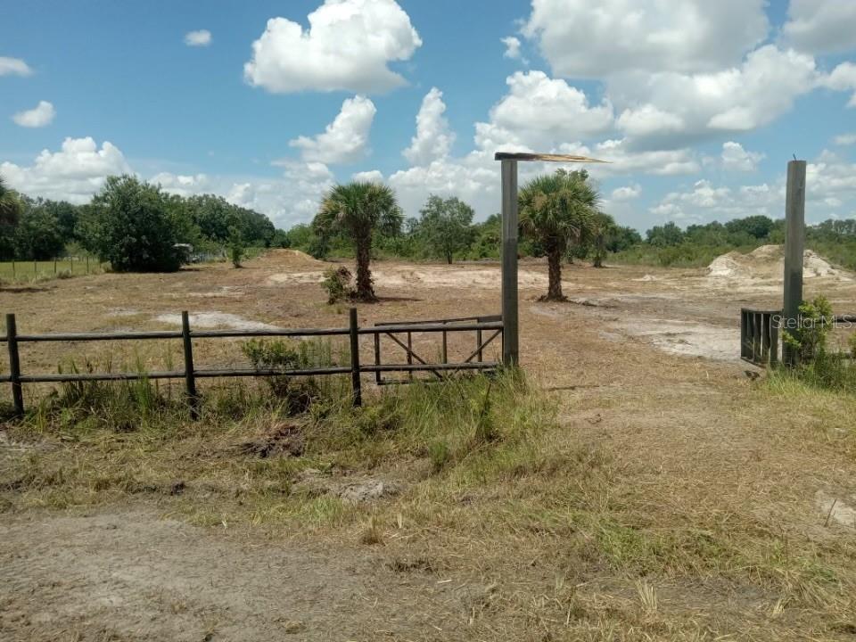 Build or bring your dream home on this spacious 1.50-acre lot. Property is already cleared, fenced with a gate and culvert in place. House pad, extra fill and a retention pond is on the property making it ready to build. The seller has invested over $18,000 in fill. Survey has been done and is available. This lot is just one lot off the paved road. Residents can enjoy the privacy of a rural setting while still being close to essential amenities. The area is a haven for outdoor enthusiasts, boasting attractions like the Kissimmee River Preserve State Park and the expansive Lake Okeechobee, famous for its excellent fishing opportunities. Whether it's fishing, hunting, agriculture, or simply a desire for privacy, Okeechobee County provides an idyllic backdrop to create a personalized retreat.