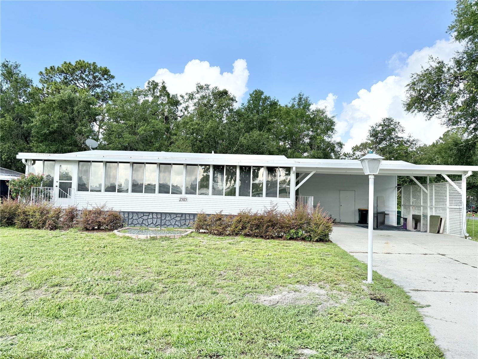 One or more photo(s) has been virtually staged. Spacious & Updated Home Minutes from Downtown Mount Dora — Low HOA & Active 55+ Lifestyle!
Enjoy the best of Florida living in this fully updated Palm Harbor home, offering over 1,400 square feet of airy, open space in the welcoming 55+ community of Dora Pines. Inside, you’ll find soaring ceilings, generously sized bedrooms, and a flowing layout that connects seamlessly to a modern, upgraded kitchen—perfect for entertaining or relaxing in style.
This home is packed with features for year-round comfort, including a 2-inch insulated roof-over, IQ air filtration system, double-pane front windows, and a moisture barrier beneath the home.
Step outside to a landscaped double lot, double carport, and oversized shed, offering plenty of room to enjoy the outdoors and store your extras. And with a very low HOA of just $60/month, you’ll have access to a community pool, clubhouse, and plenty of planned activities—making it easy to stay active, social, and connected.
Located just minutes from the shopping, dining, and charm of historic downtown Mount Dora, this move-in ready home offers the perfect balance of value, space, and lifestyle. Come see it today!