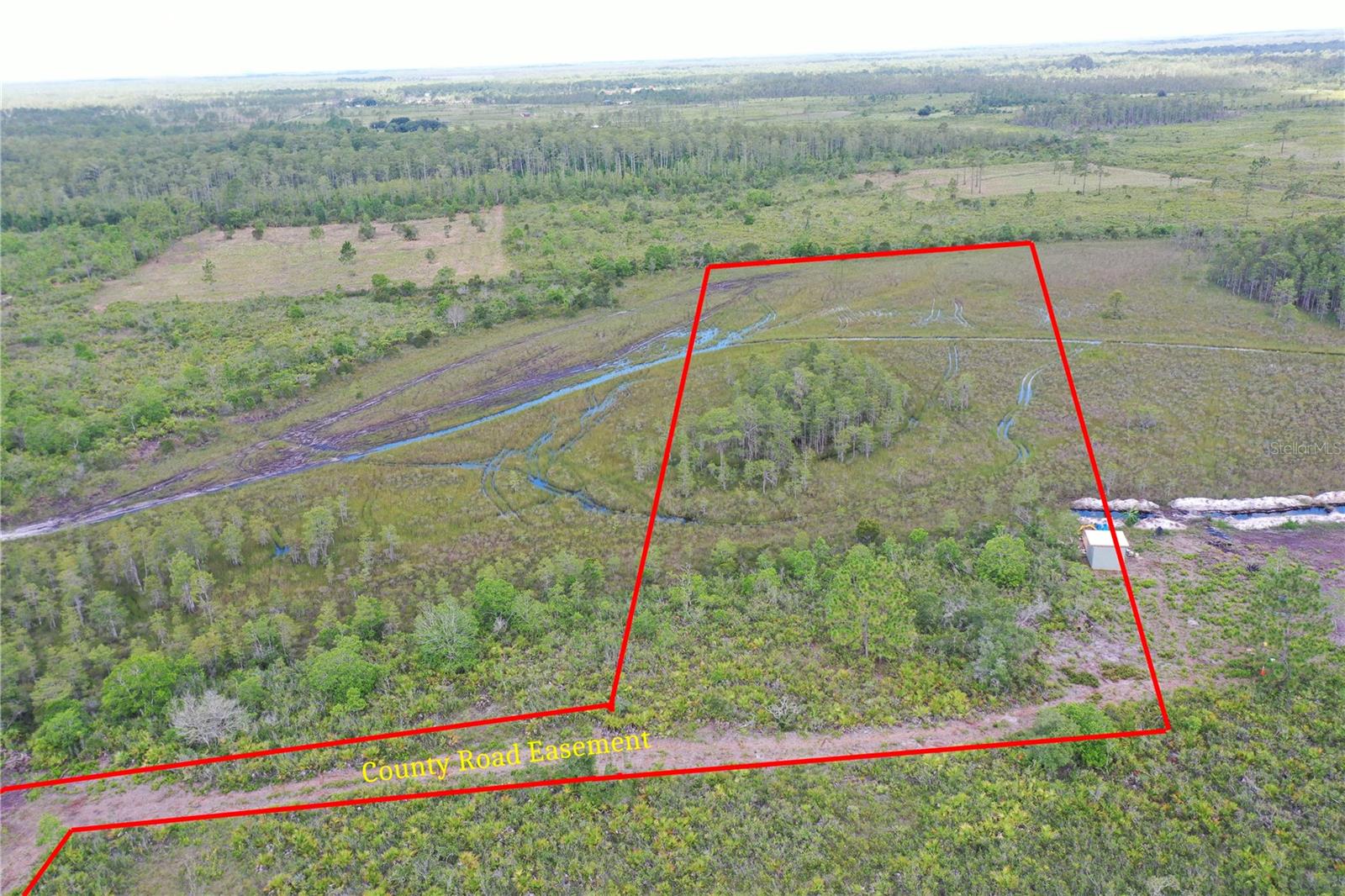 This is an untouched land with dirt road access. Seller has a survey available. 2.5 aces of beautiful quiet land. Bring your dreams and ideas to this secluded area. this is deeded land and is not recreational but actual owned private land that you will purchase. The area next door is know as Bull Creek. Bull creek land is attached to this neighborhood where you can hunt, go on trails, fish and there is camping there also. This land is a dream for some to own. 28 miles form Melbourne and 3.5 miles from Holopaw. Dont miss this opportunity.