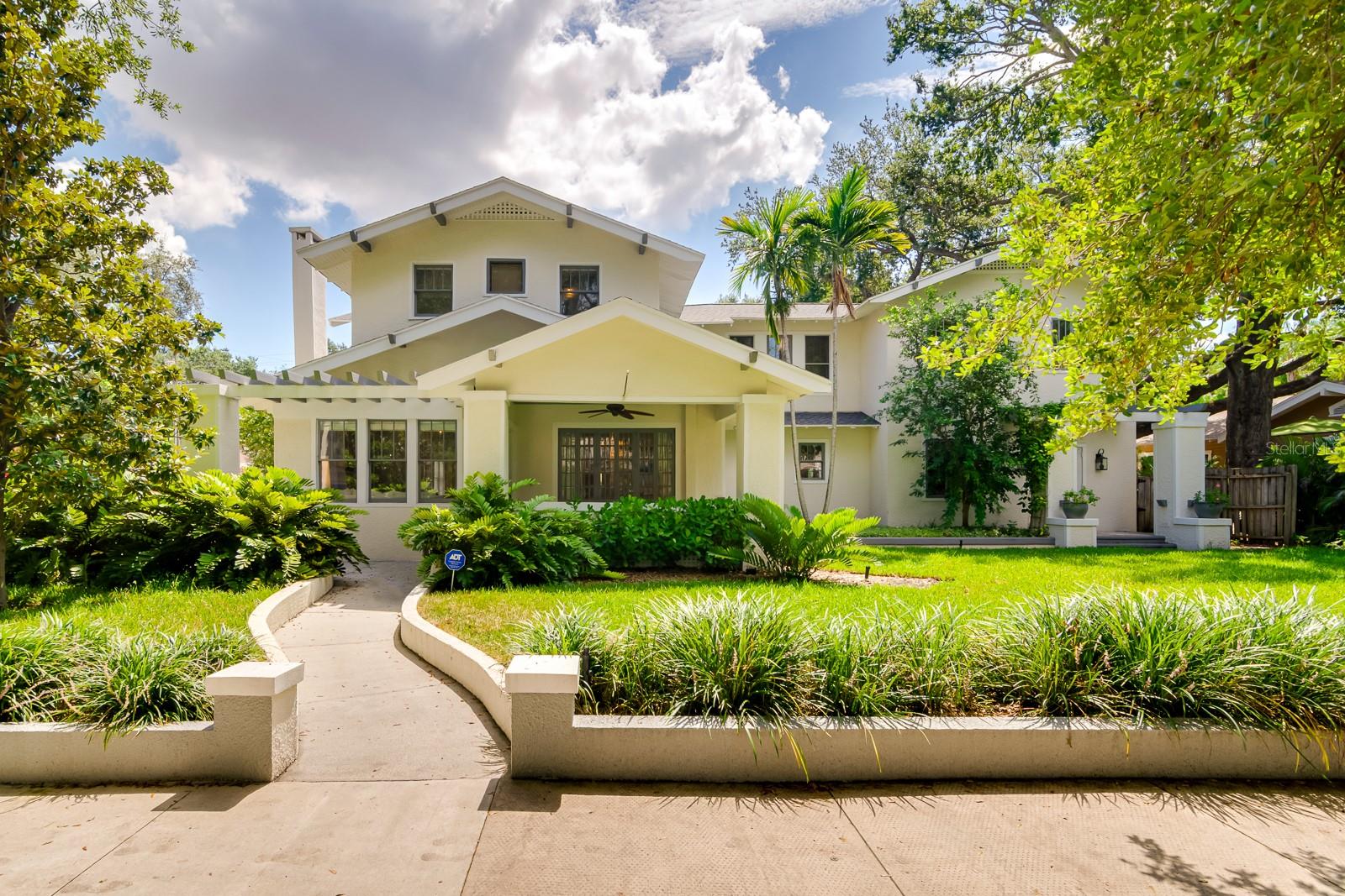Elegant Hyde Park Home on Oversized Corner Lot Just one block from Hyde Park Village’s boutique shops and fine dining, this spacious residence offers historic charm with modern upgrades. The heart of the home is a gourmet kitchen with abundant cabinetry and counter space, opening to a large family room and covered back porch with an outdoor kitchen—perfect for entertaining. The first floor features formal living and dining rooms, a home office, and a guest bedroom. Wine lovers will appreciate the walk-in refrigerated wine room. Upstairs, the expansive owner’s suite includes a custom walk-in closet and a beautifully appointed en-suite bath. Two more bedrooms, two baths, and a walk-in laundry room complete the second floor. Step outside to a tropical backyard oasis with a freeform pool, stone waterfall, hot tub, and lush landscaping. A detached 2-car garage offers easy car access and includes a guest apartment above with living room, kitchenette, bedroom, and bath. With 5,041 total sq ft of living space (main house: 4BR/4BA, 4,289 sq ft + guest apartment: 1BR/2BA, 752 sq ft), this home combines luxury, location, and lifestyle in one of Tampa’s most sought-after neighborhoods. 3D Virtual Tour: https://my.matterport.com/show/?m=kuxtVSTYJYQ&mls=1