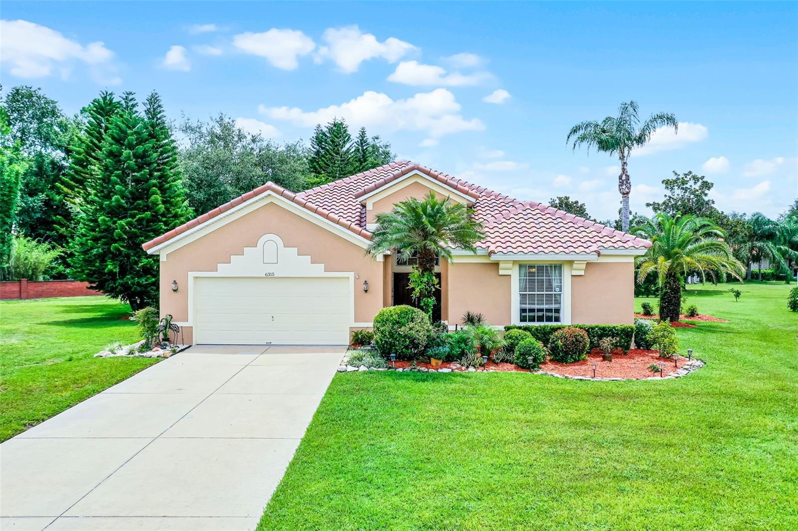 This must-see home is ready to welcome you to the exclusive and upscale gated
subdivision of Glenmuir. This spacious property is in an A-rated school district just
minutes from Disney, Universal, Sea World, Downtown Windermere, and Winter
Garden. Located on a quiet cul-de-sac with nearly half an acre to mold to your taste, it
has been over 10 years since one of these 2077 sq ft models has come on to the
market. Enter through the double front doors to the open-concept great room that
features a retractable sliding glass door to extend your space to the 350 sq ft covered
and enclosed patio. The sizable kitchen is equipped with sturdy, solid wood cabinetry,
abundant storage, white quartz countertops, stainless steel appliances, and an eat-in
breakfast nook. The large primary suite has an expansive walk-in closet, an oversized
bathroom with separate vanities, garden tub, and private water closet. The remaining
two bedrooms are a generous size with ample natural lighting. The guest bath is
recently remodeled with an upgraded custom shower.
The home is well maintained with a BRAND-NEW Spanish tile roof installed in JULY 2025,
sprinkler system upgraded in June 2025, hot water heater installed in 2020, and A/C
replaced in 2017.
Enjoy the amenities of this well-established and treed neighborhood, including a
community park with a playground, basketball courts, and covered picnic area.
This home is perfectly situated nearby to major highways including the 408, 429, I-4,
and Florida’s Turnpike, and is located near world-famous shopping outlets, golf, and
attractions. Don’t miss out on this perfect opportunity to call Central Florida your home.