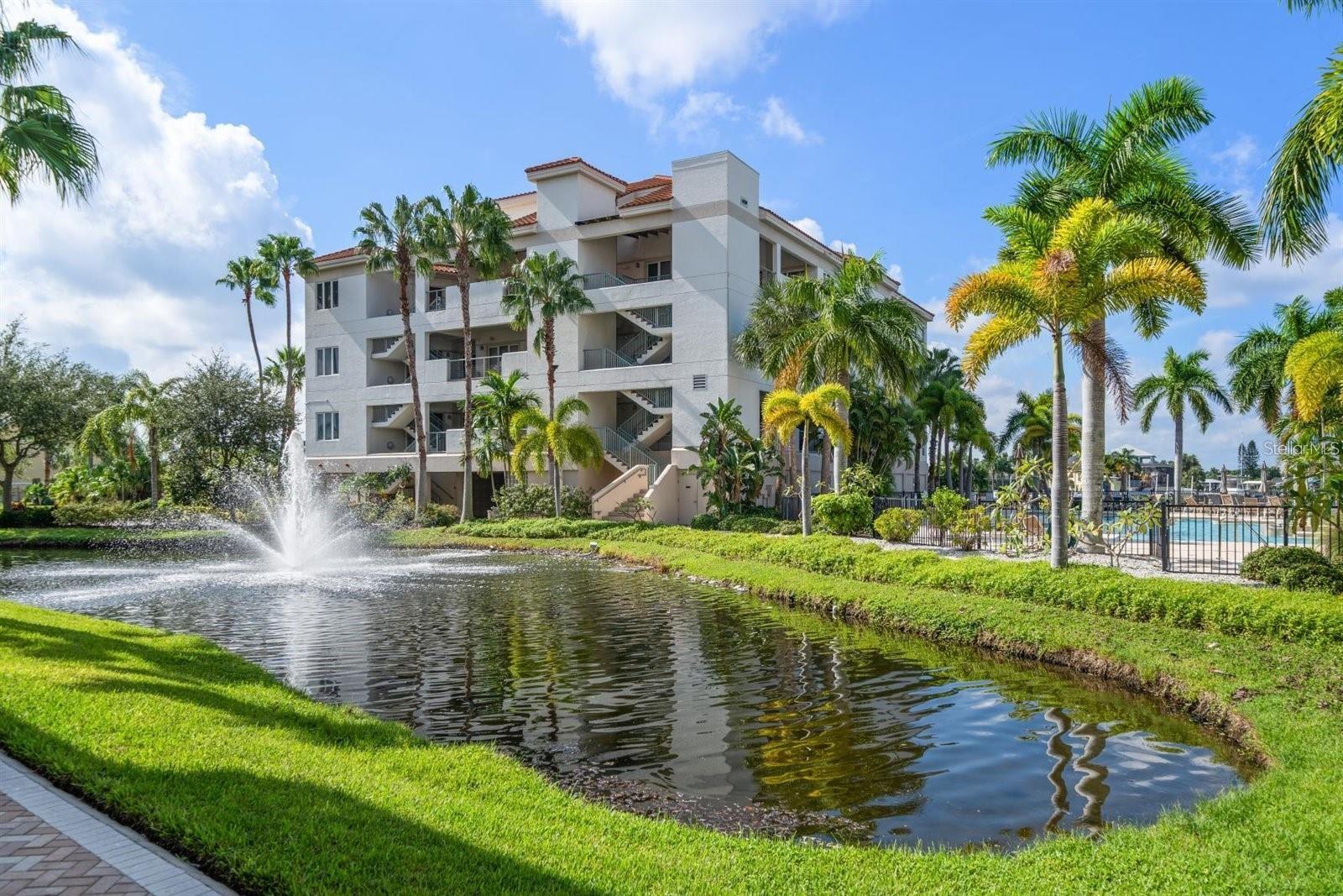 Welcome to Bellasol a premier luxury waterfront community in Apollo Beach! This second-floor corner condo offers the perfect blend of elegance, functionality, and coastal charm. Some pictures are virtually staged. Featuring 3 bedrooms, 3 full bathrooms, an oversized two-car garage (580 sq. ft.) This home is designed for comfort and convenience. The covered front porch provides easy access to both the elevator and stairs. A deeded boat slip with water/electric (max 32' boat) is available for an extra charge. Step inside through a solid wood front door and be greeted by an open, inviting floor plan with hardwood flooring throughout the main living areas. The formal dining room boasts a tray ceiling and crown molding—perfect for entertaining. The great room is bathed in natural light from numerous windows and sliding doors that lead to the spacious rear balcony. The gourmet kitchen is a chef’s dream, featuring wood cabinetry, granite countertops, stainless steel appliances, a stylish backsplash, double sinks, and a large island with bar seating—ideal for hosting and socializing. The primary suite ,offers ultimate privacy with water views, a tray ceiling, crown molding, wood plank tile flooring, a spacious 10'x8' walk-in closet, and direct access to the balcony. The en-suite bath is a spa-like retreat, complete with a granite double vanity, soaking tub, and walk-in shower.
Additional highlights include:
• A guest bedroom with a queen-size Murphy bed and private en-suite • A third bedroom with an adjacent full bath • A versatile office/study with custom floor-to-ceiling built-ins and French doors—can be used as a 4th bedroom • Ceiling fans in all bedrooms • Cat5 network wiring throughout • Kayak launch and marina access with no fixed bridges to Tampa Bay
Bellasol amenities enhance the luxury lifestyle: a 24/7 fitness center, community clubhouse with rentable event space, bathrooms, propane grills, resort-style pool with hot tub, tiki bar, high-speed internet, and security cameras at the gated entrance. The oversized garage offers ample room for vehicles plus custom built-in storage. Water, trash, and internet are all included. Perfectly positioned between Sarasota and Tampa, and walking distance to top local restaurants (Finn’s, Apollo Pizza, Cigar Bar) and the beach, this waterfront condo is more than a home—it's a lifestyle. Enjoy quick boating access to Tampa Bay and compare the value—you'll be amazed. NO storm damage. Schedule your private showing today!