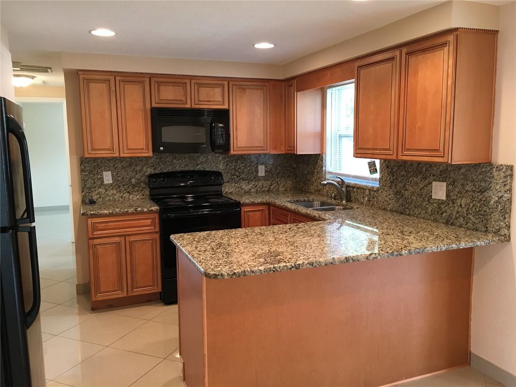 Photo of 1050 Clairborne Street, Holiday, FL 34690 (MLS # W7884203)