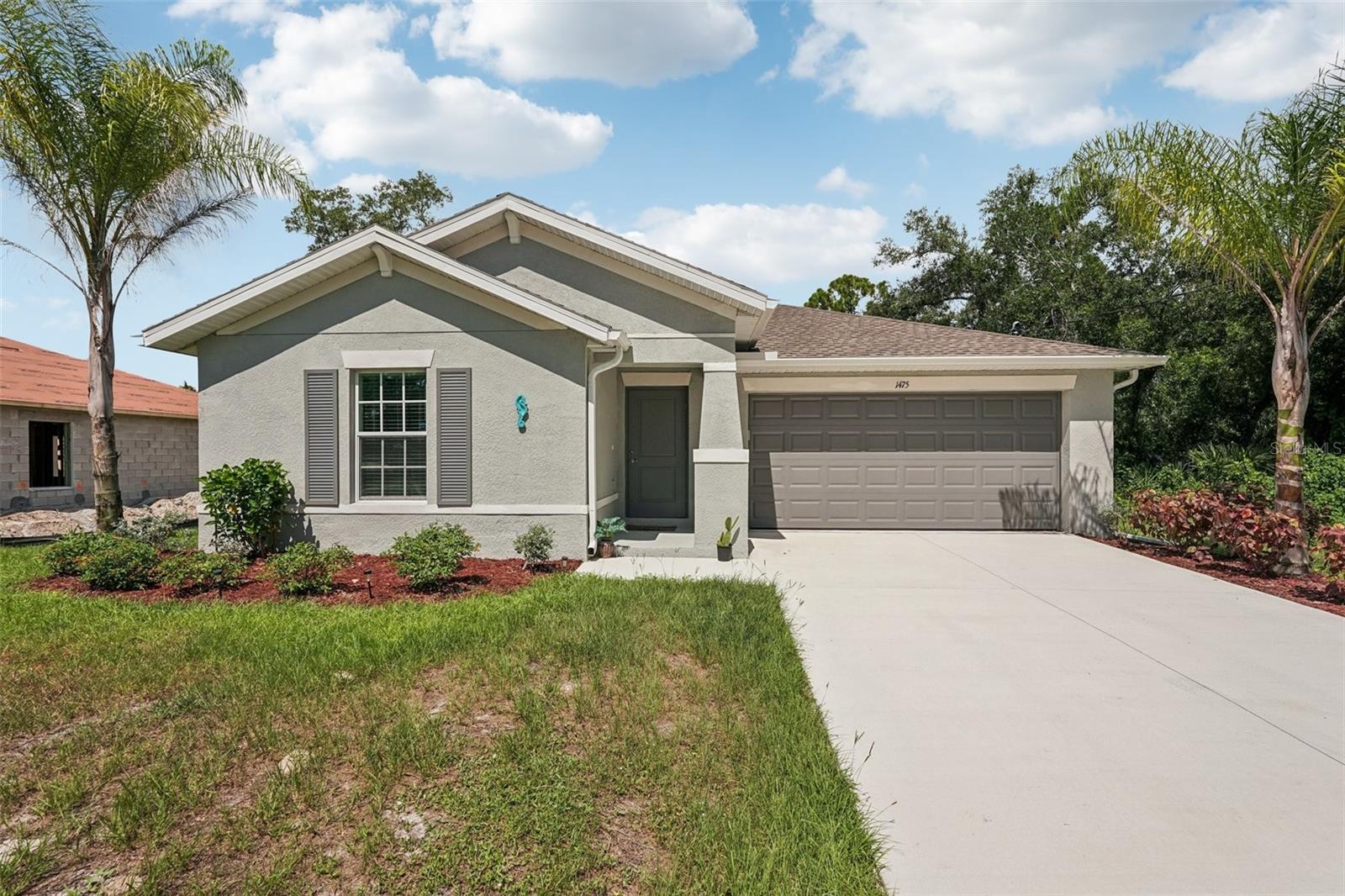 Welcome to this nearly new 3-bedroom, 2-bath home in the desirable Port Charlotte area. Built just 2 years ago, this residence showcases modern design and a functional split layout, offering both comfort and privacy.
The open-concept living area is bright and inviting, featuring quartz countertops that add a touch of elegance to the kitchen. The seamless flow between the kitchen, dining, and living spaces makes it ideal for both everyday living and entertaining.
The primary suite is thoughtfully positioned apart from the guest bedrooms, providing a private retreat complete with a spacious en-suite bath. Two additional bedrooms and a second full bath offer flexibility for guests, a home office, or a hobby room.
Located close to the beautiful Charlotte Harbor Aquatic Preserve, this home offers easy access to outdoor recreation and scenic views. You'll also enjoy the convenience of nearby shopping, dining, and essential services, ensuring everything you need is just minutes away.
With its modern construction, stylish finishes, and prime location, this move-in-ready home is perfect for those seeking a blend of comfort, quality, and convenience in Port Charlotte. Schedule your private showing today and experience all this property has to offer!