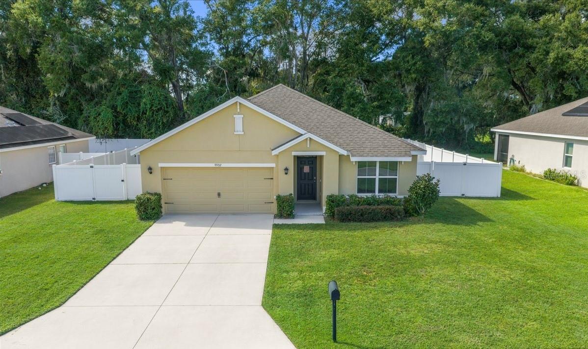 Introducing this beautiful 3-bedroom, 2-bath, 1,670 SqFt home built in 2019 with a two-car garage, perfectly situated in the quiet, family-friendly community of Cobblestone North. Designed for comfort, this home features a spacious open floor plan that’s ideal for both everyday living and entertaining. The living room flows seamlessly into the kitchen, which offers a cooking island, pantry, and plenty of cabinet space. Primary bedroom is privately located at the back of the home, includes a walk-in closet and an ensuite bathroom featuring a tile walk-in shower. Two additional bedrooms share a second full bathroom, and the laundry room is equipped with a stackable washer and dryer for added convenience. Through the sliding glass doors, you’ll find a screened-in porch overlooking the fully fenced backyard, enclosed by a vinyl fence installed in 2022, perfect for relaxing or entertaining outdoors. Conveniently located within minutes to Belleview High and Middle Schools and just a short drive to Belleview Santos Elementary, this home is also close to a variety of stores, restaurants, and everyday conveniences, offering both comfort & convenience in a highly desirable area. Don’t wait, schedule your private showing today!