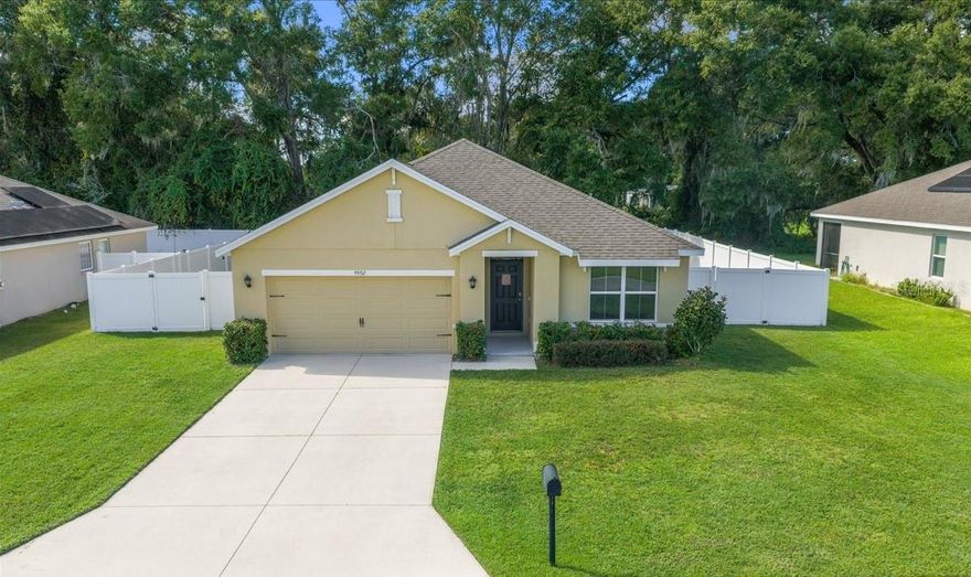 Introducing this beautiful 3-bedroom, 2-bath, 1,670 SqFt home built in 2019 with a two-car garage, perfectly situated in the quiet, family-friendly community of Cobblestone North. Designed for comfort, this home features a spacious open floor plan that’s ideal for both everyday living and entertaining. The living room flows seamlessly into the kitchen, which offers a cooking island, pantry, and plenty of cabinet space. Primary bedroom is privately located at the back of the home, includes a walk-in closet and an ensuite bathroom featuring a tile walk-in shower. Two additional bedrooms share a second full bathroom, and the laundry room is equipped with a stackable washer and dryer for added convenience. Through the sliding glass doors, you’ll find a screened-in porch overlooking the fully fenced backyard, enclosed by a vinyl fence installed in 2022, perfect for relaxing or entertaining outdoors. Conveniently located within minutes to Belleview High and Middle Schools and just a short drive to Belleview Santos Elementary, this home is also close to a variety of stores, restaurants, and everyday conveniences, offering both comfort & convenience in a highly desirable area. Don’t wait, schedule your private showing today!