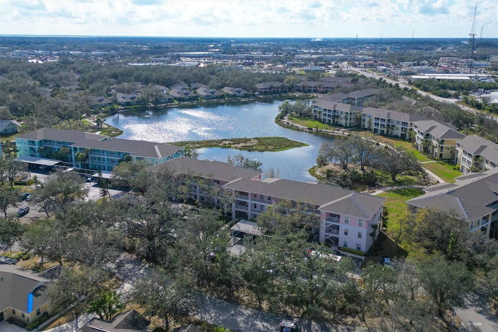 Location!! Location!!! Don't miss this immaculately maintained condo in beautiful Heritage Oak Park! This well maintained condo features a beautifully updated kitchen with Silestone Granite, 42" cabinets, a newer refrigerator and dishwasher. The rest of the condo has laminated floors...tile in wet areas, ceiling fans thru-out and more! You'll never get tired of the sunset views from this top floor end unit. Heritage Oak Park is a gated community located near shopping and across from the YMCA. The community has a large clubhouse, giant heated swimming pool, library, Shuffle Board, Tennis, Bocci Ball, extensive social functions, tree lined streets and paths for walking or bike riding. The community is meticulously landscaped for a very serene setting...one of the best communities in Port Charlotte!