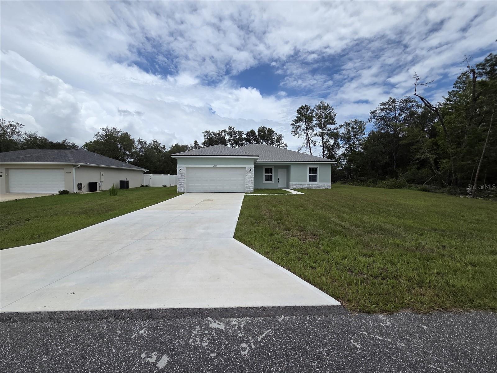 Welcome to this beautifully designed home located in the desirable Marion Oaks community of Ocala, Florida. Featuring a wide open floorplan with split-bedroom design for added privacy, this home effortlessly combines style, comfort, and function. Step inside to find luxury vinyl plank flooring throughout, creating a seamless, durable, and low-maintenance foundation. The modern kitchen is a true showstopper, boasting white shaker cabinets, port white quartz countertops, and bold matte black fixtures that add a striking contrast. Stainless steel appliances complete the contemporary look, making it perfect for both everyday living and entertaining.
The primary suite is your personal retreat, offering a massive walk-in closet and a spa-like en suite bathroom complete with a sleek soaking tub, separate walk-in shower, and a private water closet. The secondary bedrooms are generously sized, perfect for family, guests, or a home office. Outside, enjoy a spacious backyard, ideal for gatherings, play, or peaceful relaxation under the Florida sun.
With its sophisticated finishes and thoughtful layout, this Marion Oaks gem won’t last long. Schedule your private tour today and experience the perfect blend of modern living and timeless appeal!