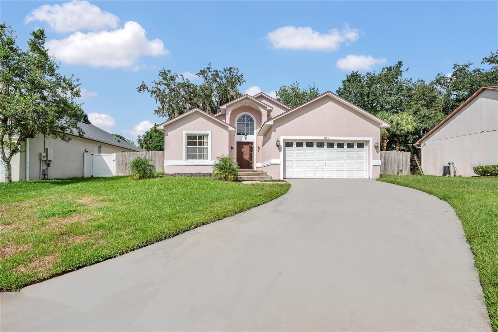 Welcome home to this beautifully maintained residence nestled in a quiet cul-de-sac within the highly desirable Riverside at TwinRivers community in Oviedo. This light-filled home features fresh interior paint and gleaming tile flooring throughout, creating a bright and open layout. Three sets of sliding doors flood the living space with natural light and seamlessly connect indoor and outdoor living.
The spacious kitchen is a chef’s dream with stainless steel appliances, wood cabinetry, and a pantry with pull-out drawers for added convenience and organization. Recent upgrades include a BRAND NEW A/C system and a NEW hot water heater, ensuring comfort and efficiency all year round.
Enjoy peaceful mornings or relaxing evenings on the tiled, screened-in back porch, or entertain in the fully fenced backyard, ideal for pets or playtime. The oversized garage offers additional storage options, perfect for staying organized.
Located in the top-rated Seminole County School District, this home is close to major employers including Siemens, Lockheed Martin, UCF, and Research Park, as well as Oviedo on the Park, shopping, dining, and entertainment options.
This move-in ready gem won’t last long—schedule your showing today and make this charming retreat your next rental home!