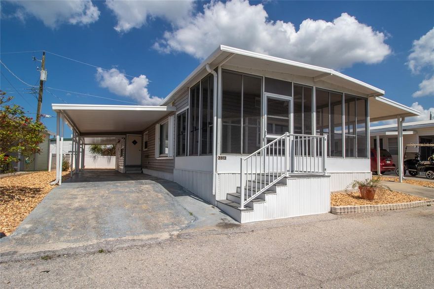 BOATERS PARADISE!!! Land-owned unit in Tropic Isles with dock and boat lift. Here is the perfect opportunity to live the Florida lifestyle. Two bedroom, two bath, completely updated, open floor plan. Bonus room, that could be an office or possibly a guest room. There are two carports with covered parking. Just steps away from your dock and the water, as well as a marina for fuel, ice and bait. The unit can come completely furnished, so just bring your toothbrush and clothes. Easy access to Tampa, St. Petersburg, and Sarasota. No bridges to navigable waters, easy boat access to Tampa Bay and the Gulf. Whether you’re a snowbird, wanting full-time living or looking for an investment property, this is your place.