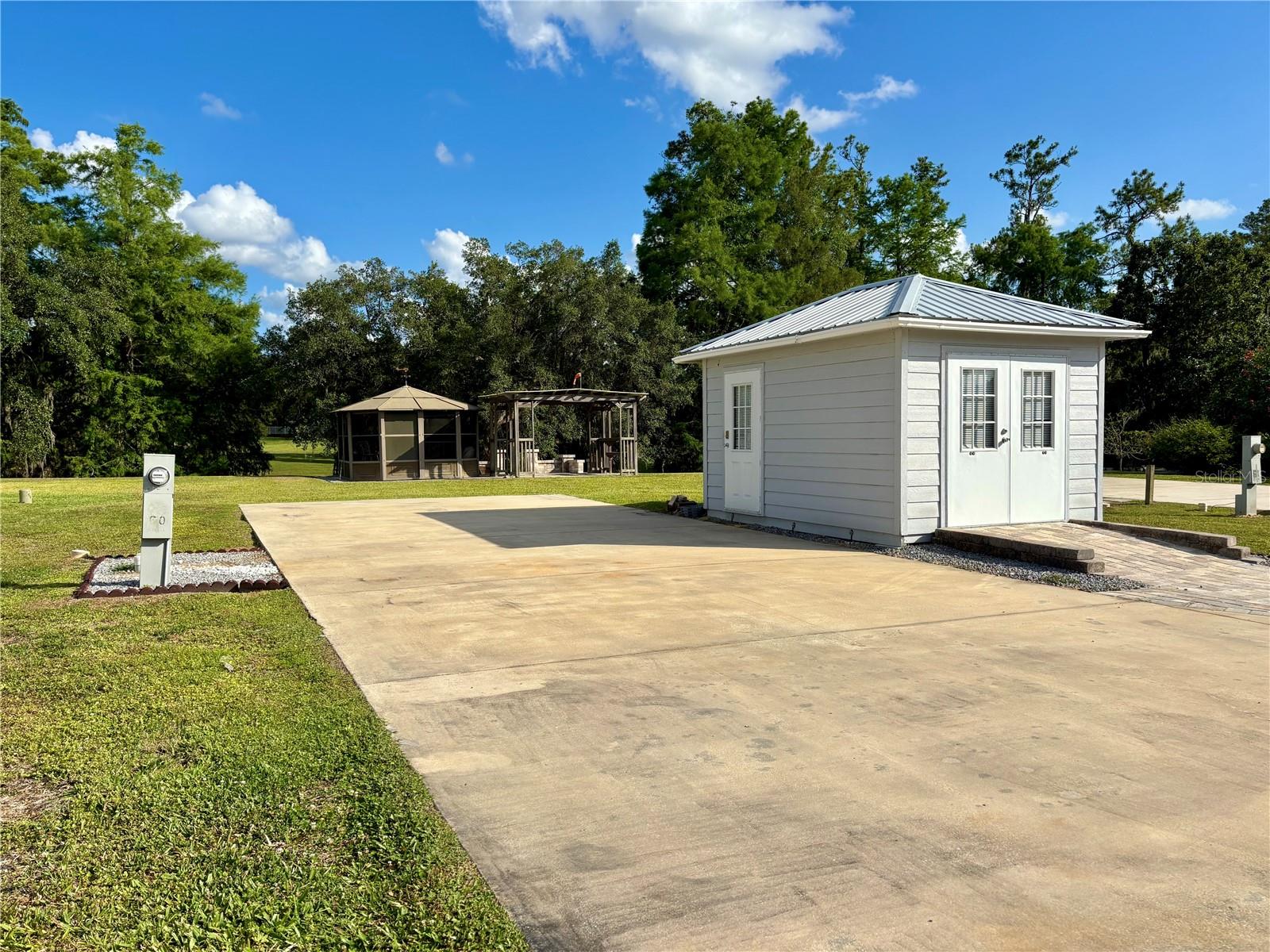 Serene RV Lot in 55+ Wilderness Preserve Estates
Near Ocala, FL!! You Own the Land!! Nature Lover’s Paradise!!
Welcome to your own piece of paradise in the highly sought-after 55+ community of Wilderness Preserve Estates. This spacious double gated deeded RV lot offers privacy, tranquility, and all the amenities you need for the perfect Florida lifestyle.
The lot is generously sized with mature landscaping and green space behind the lot, creating a peaceful and private atmosphere. A large paver patio provides the perfect setting for outdoor entertaining or simply relaxing in the warm Florida sunshine. A screened gazebo offers a comfortable space to enjoy the evenings, and an on-site storage shed adds valuable convenience. The lot backs up to a scenic, tree-lined retention pond, adding to the sense of seclusion and natural beauty.
Outdoor enthusiasts will love being just a short stroll from the Ocklawaha River, ideal for kayaking and fishing. The property also offers direct access to the extensive Greenway hiking trails, perfect for daily walks or wildlife spotting.
Community amenities include a clubhouse for social gatherings, a heated pool and hot tub for year-round relaxation, a fitness center, and shuffleboard courts. The HOA fee covers lawn care, water, sewer, trash, and road maintenance, making for easy, carefree living.
Located just minutes from Silver Springs State Park, shopping, restaurants, and historic downtown Ocala, this property also offers convenient access to Ormond Beach—only about an hour away.
Don’t miss this rare opportunity to own land in a peaceful, nature-filled 55+ community.